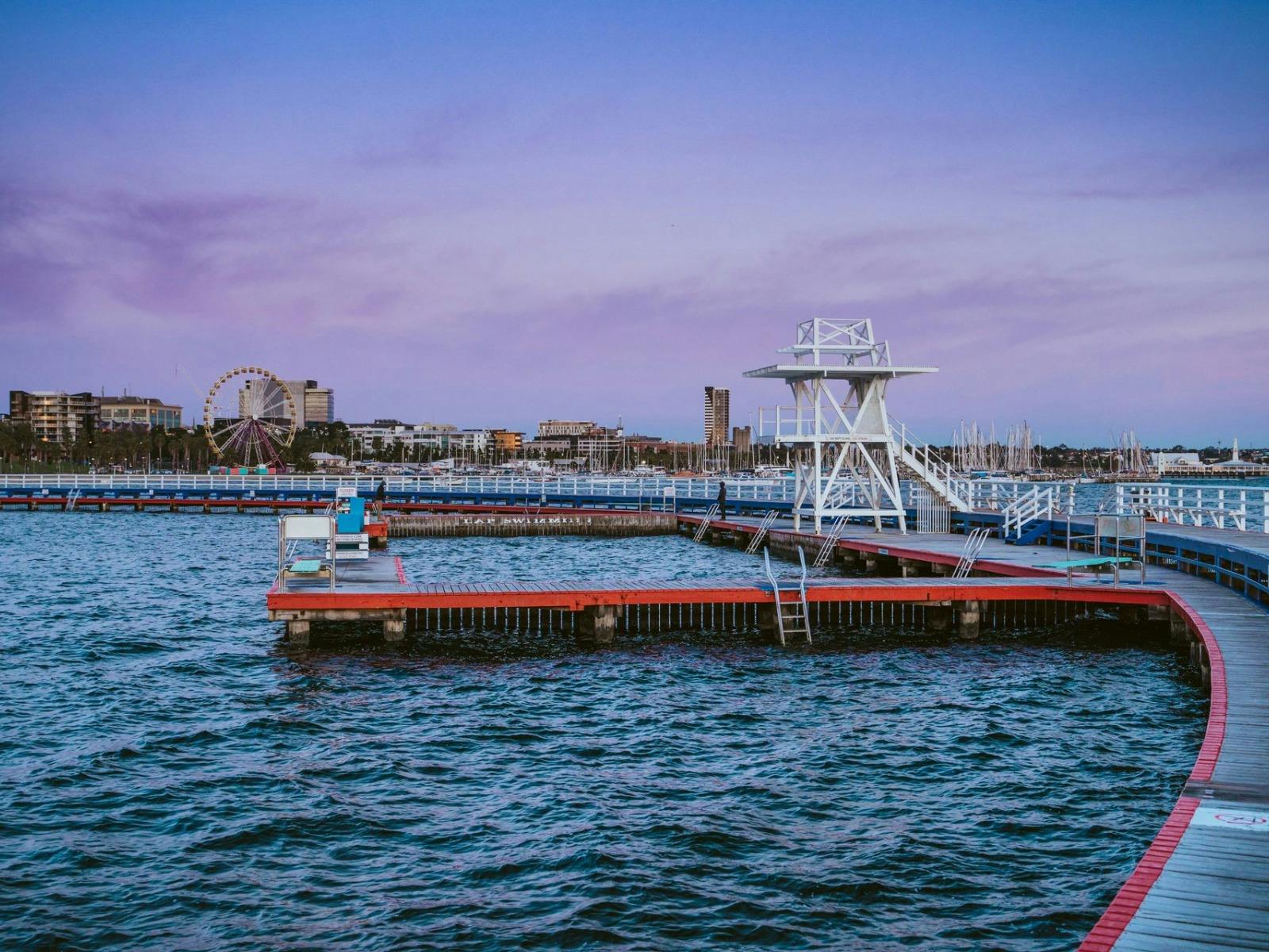The woodern walkway and diving board surrounding the waterway of Eastern Beach reserved