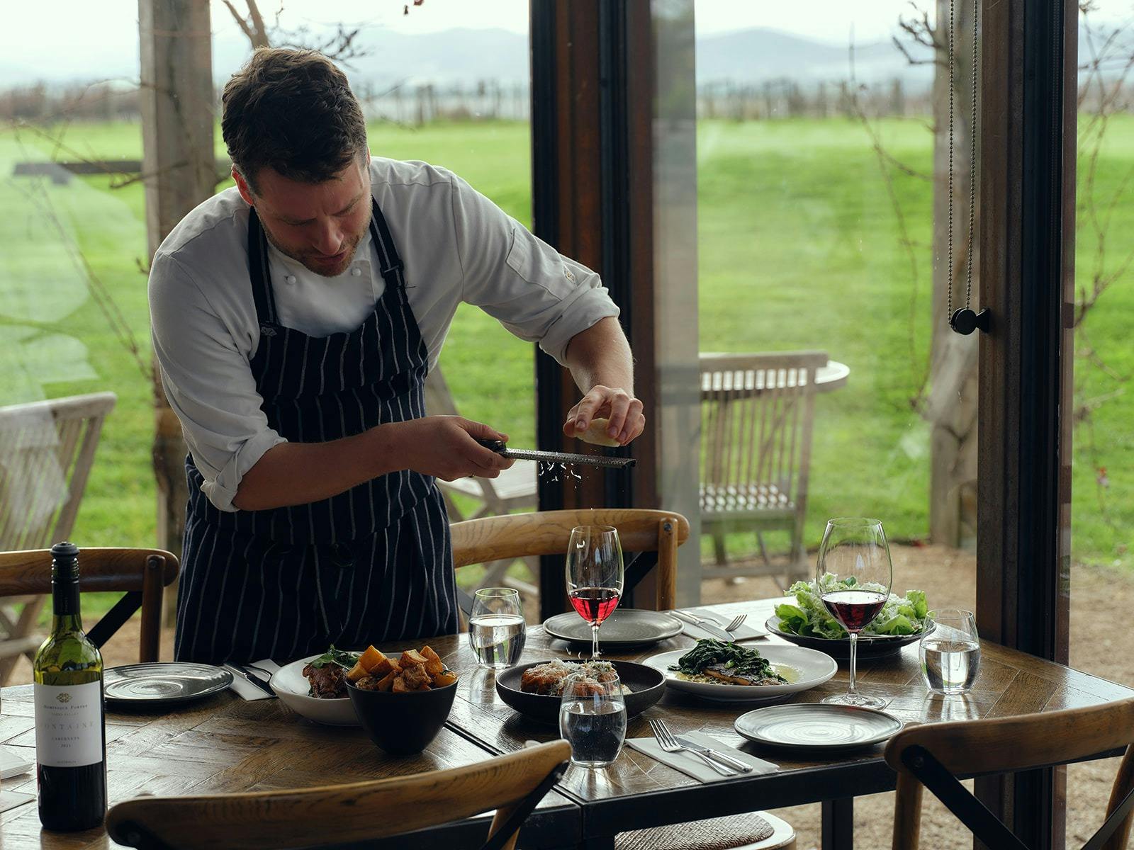 Chef putting the final touches on dishes