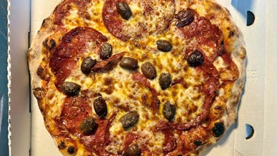Spicy Diavola pizza with spicy salami and olives