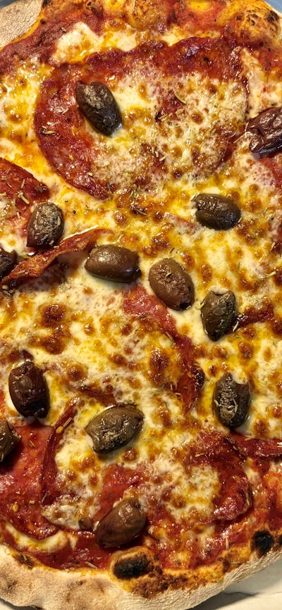 Spicy Diavola pizza with spicy salami and olives