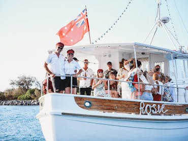 A group of people enjoying a charter boat cruise on Rosie Boat Charters , Gold Coast.