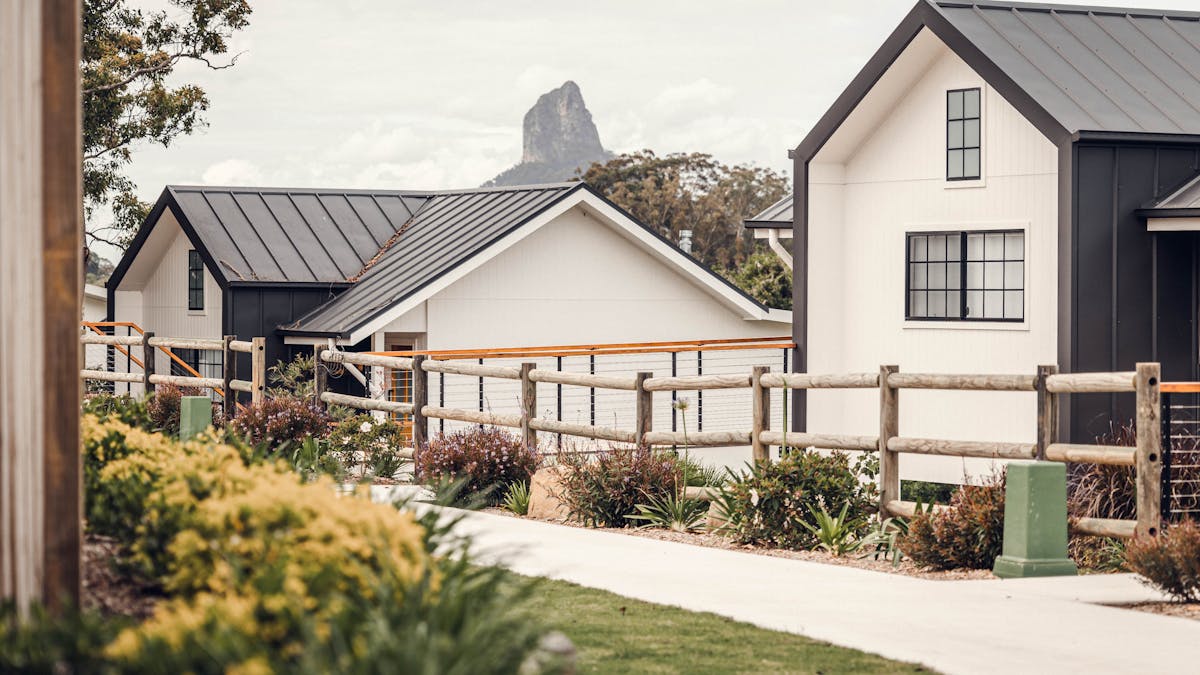 Accessible athway leading to each cabin with Glasshouse Mountains in the background