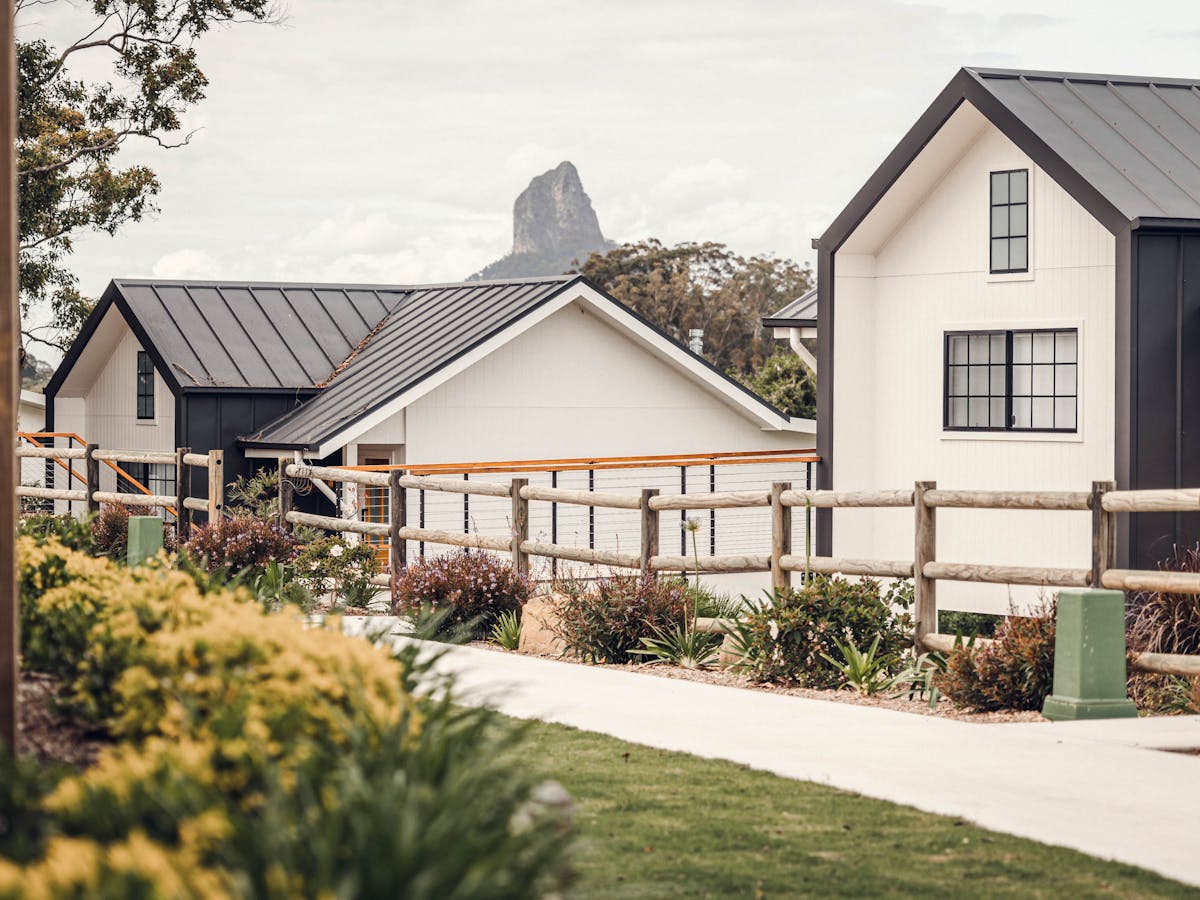 Accessible athway leading to each cabin with Glasshouse Mountains in the background