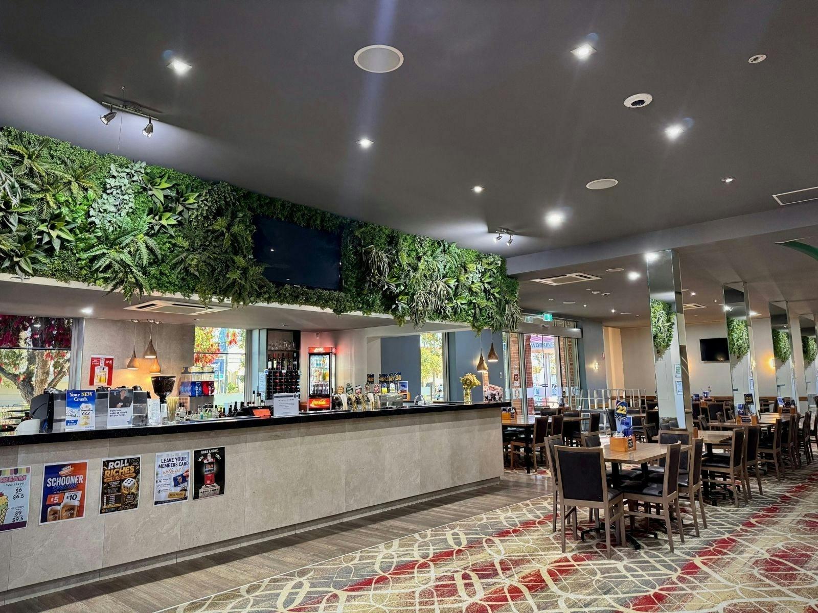 Family dining in the Bistro, with indoor and outdoor play areas for children.