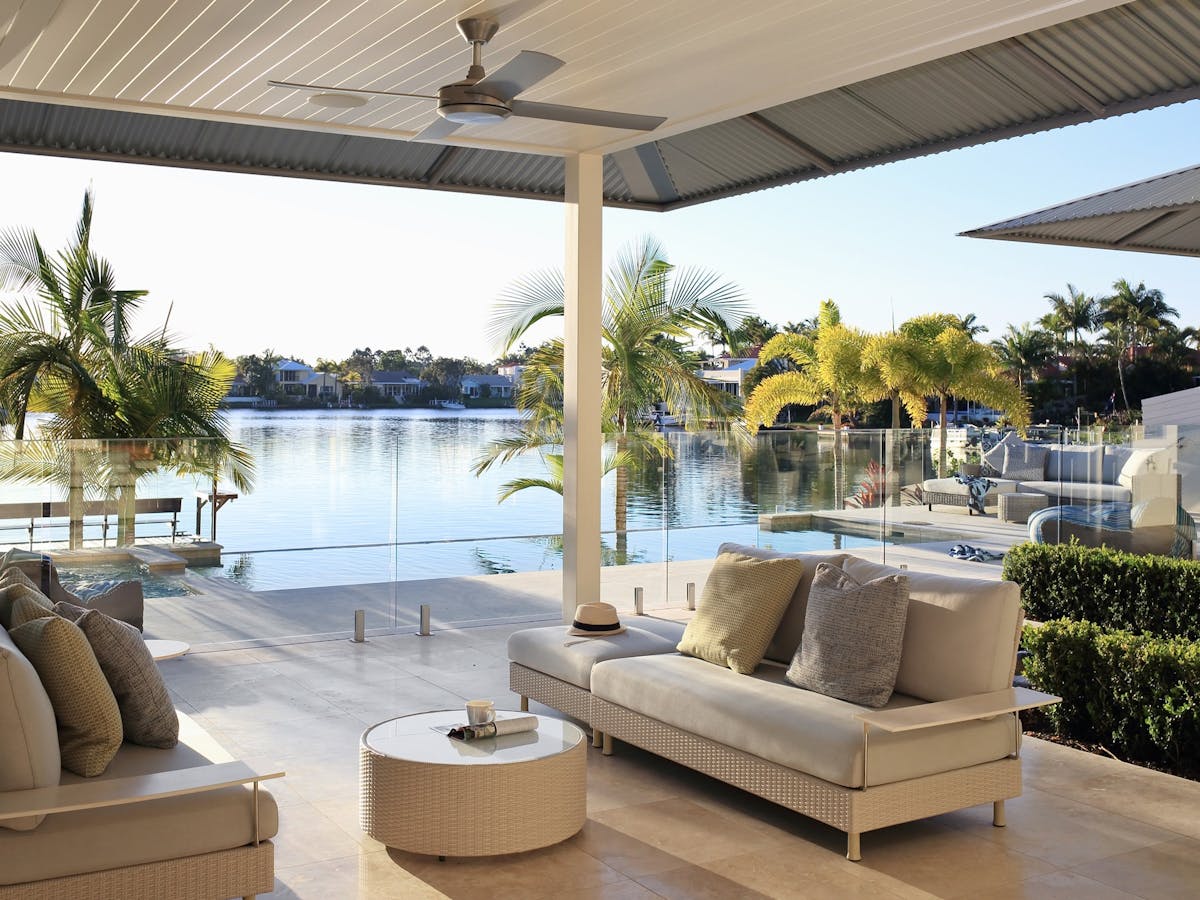 Outdoor cooking facilities include a commercial grade BBQ, wine fridge, extra seating for 8