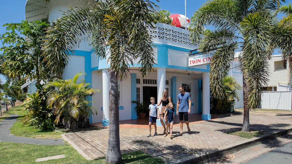 family walking in front of the Bowen Summergarden Cinema