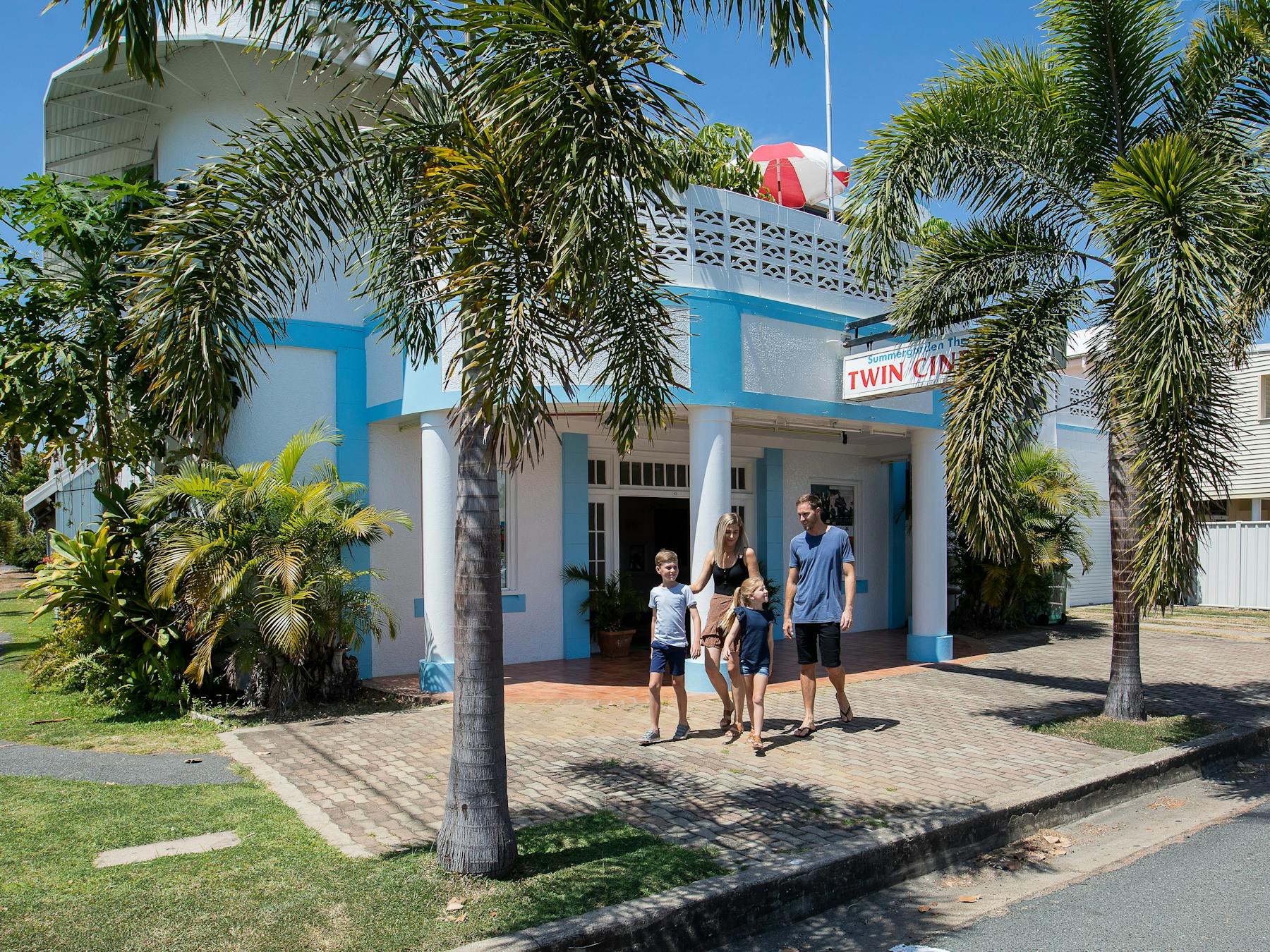 family walking in front of the Bowen Summergarden Cinema