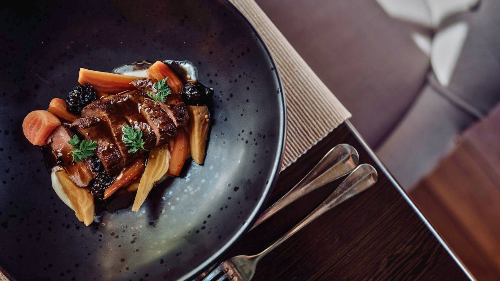 venison backstrap , wildberry chocolate jus, pickled carrots, beets with parsnip cream
