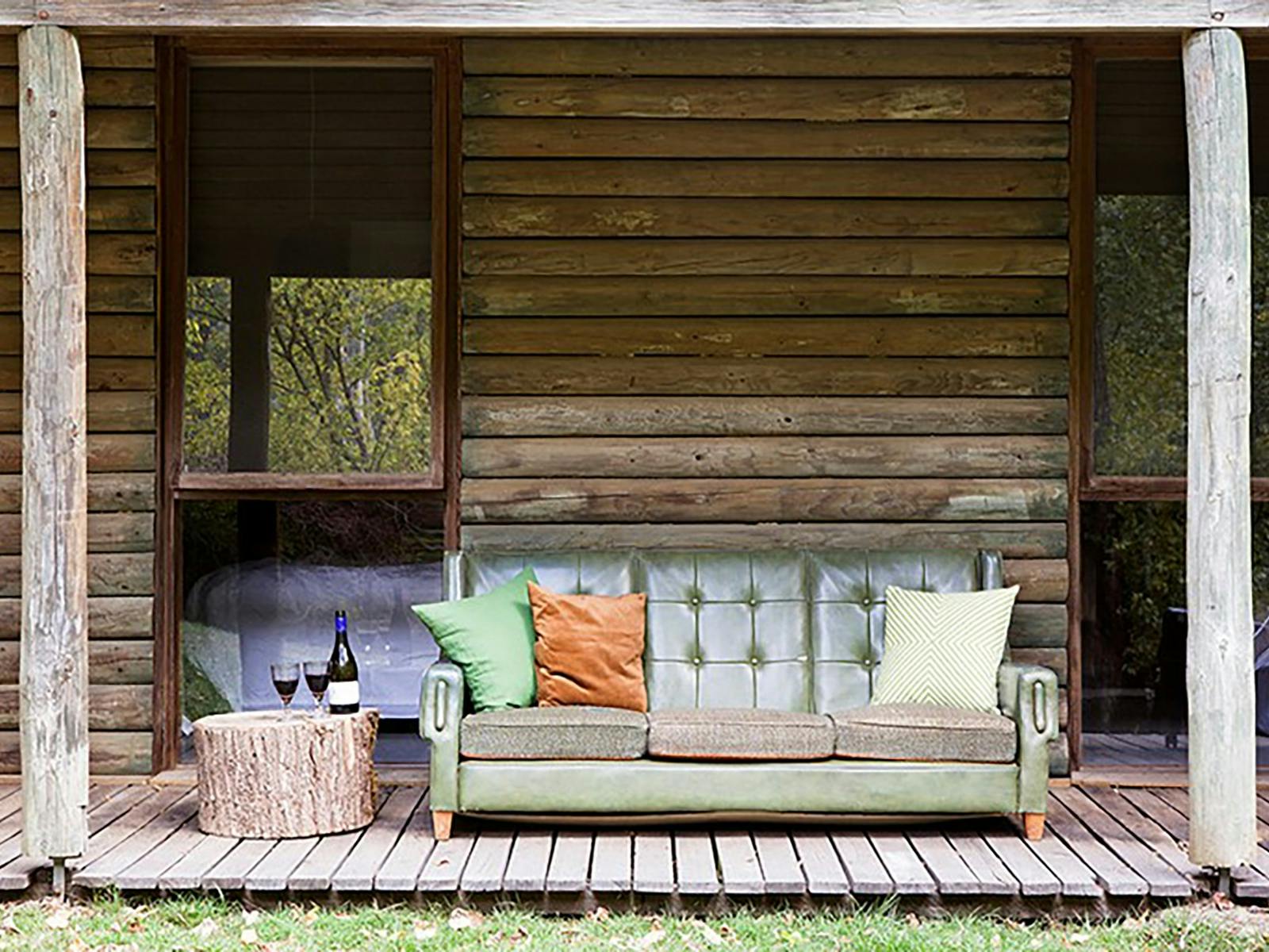 comfy couch on the deck with river view