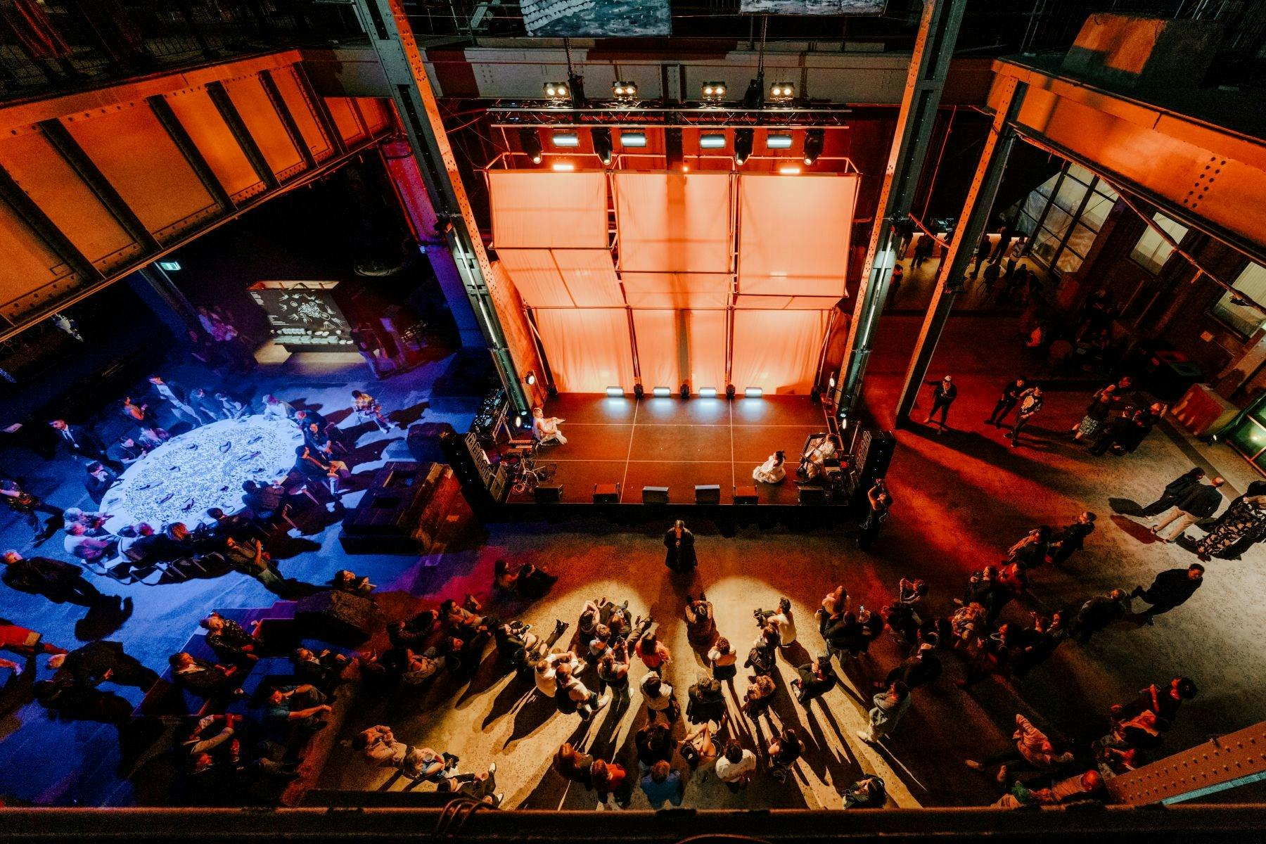 stage in power station illuminated by orange and blue light