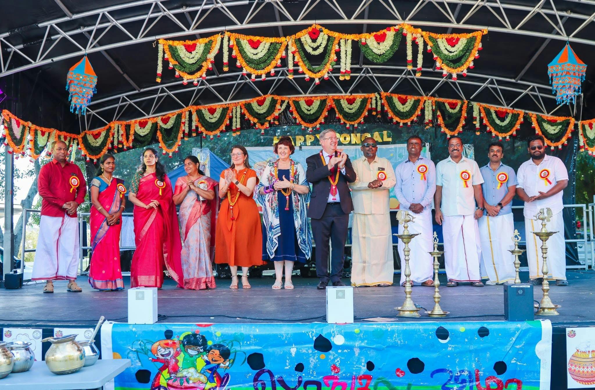Committee members with Chief guest on a decorated Stage at a Pongal celeberation