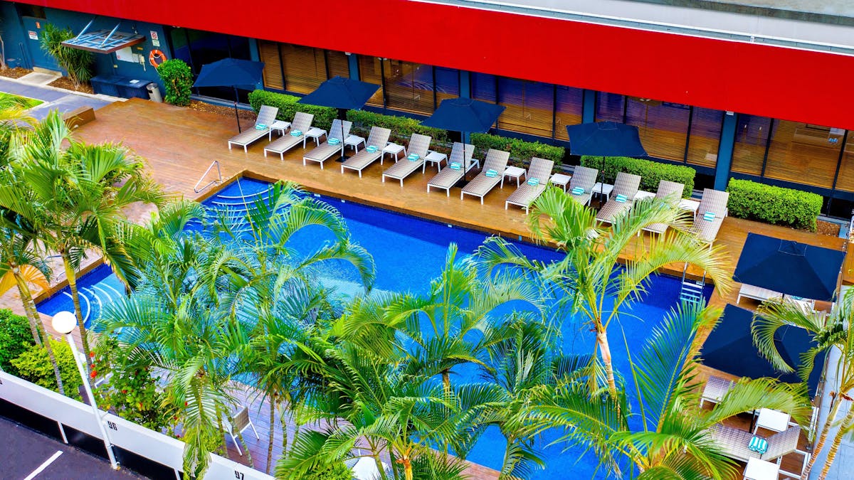 Royal on the Park outdoor pool with sundeck and sun loungers
