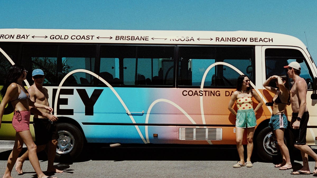 Group of travellers making friends on an East Coast bus trip
