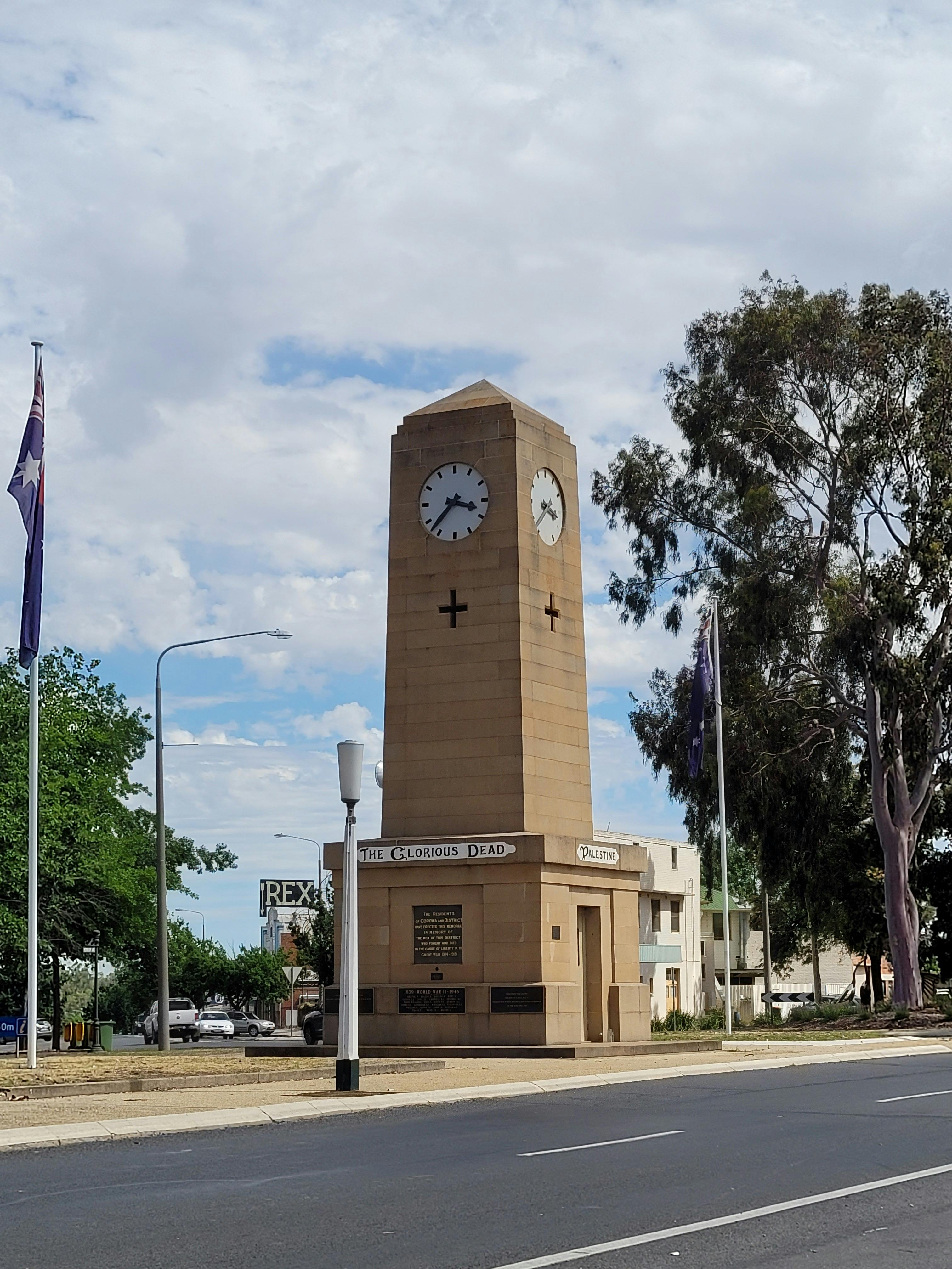 Yellow brick clock town  with the locations and fallen soldiers name from the first 2 world wars