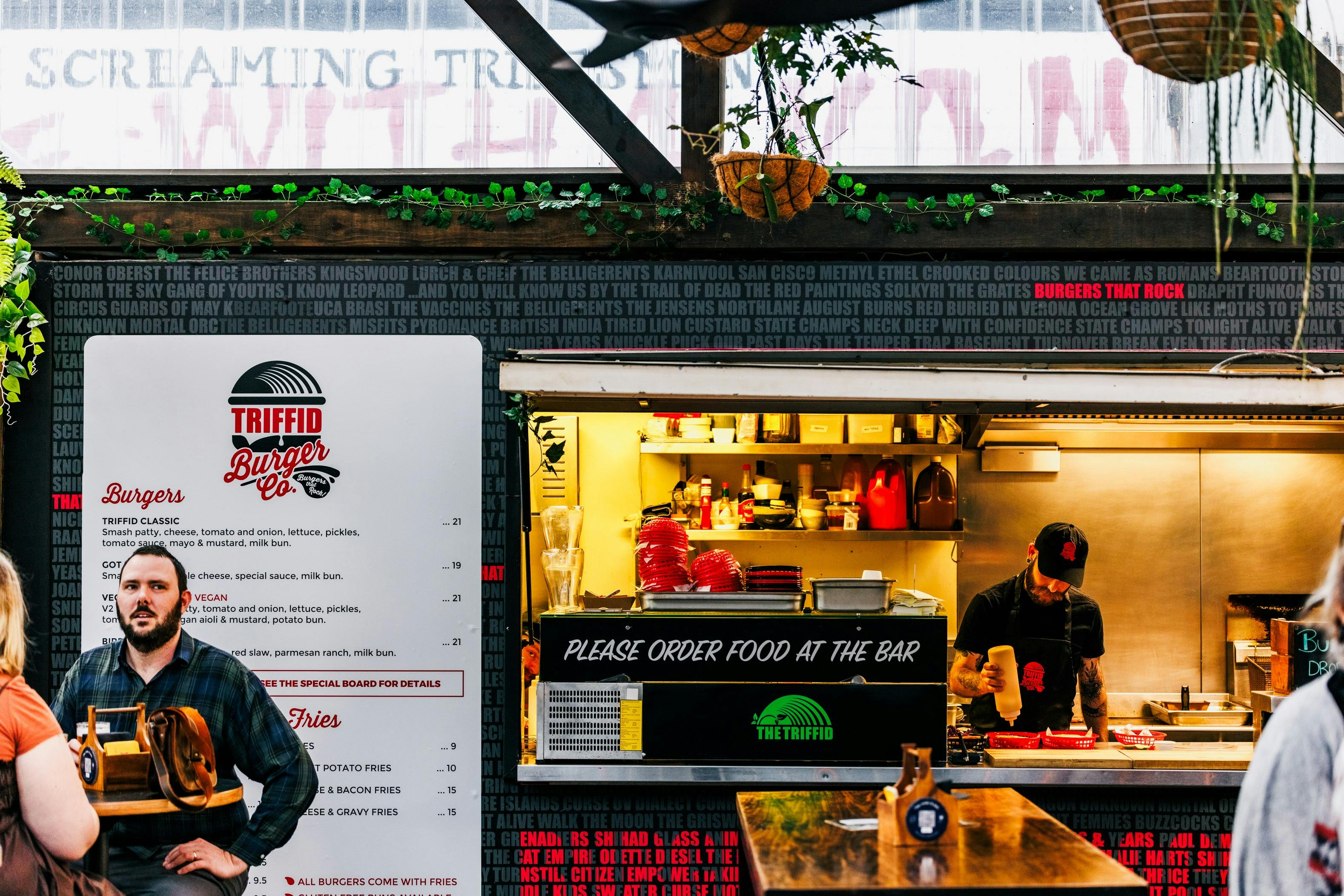 The Triffid Burger Co kitchen space with a chef working.