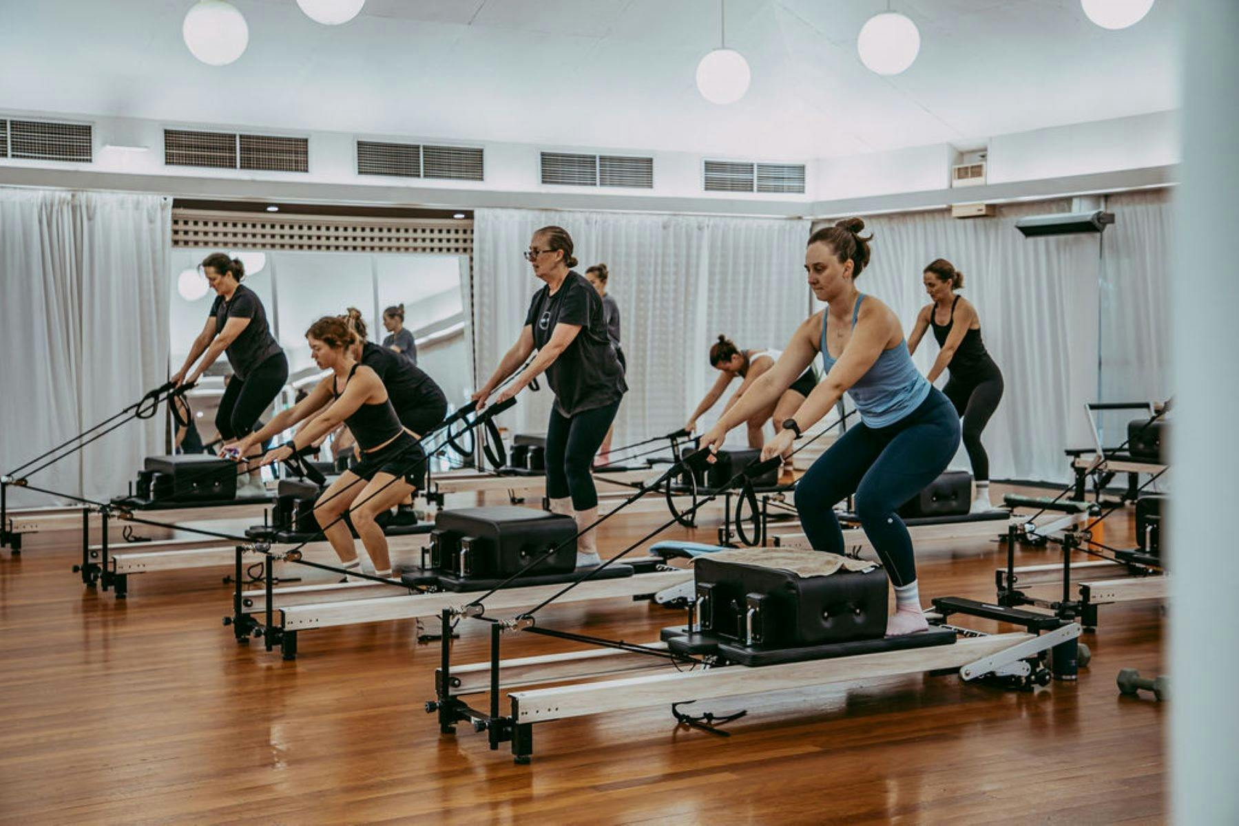 Multiple women on reformers at Sculpt Pilates Goondiwindi