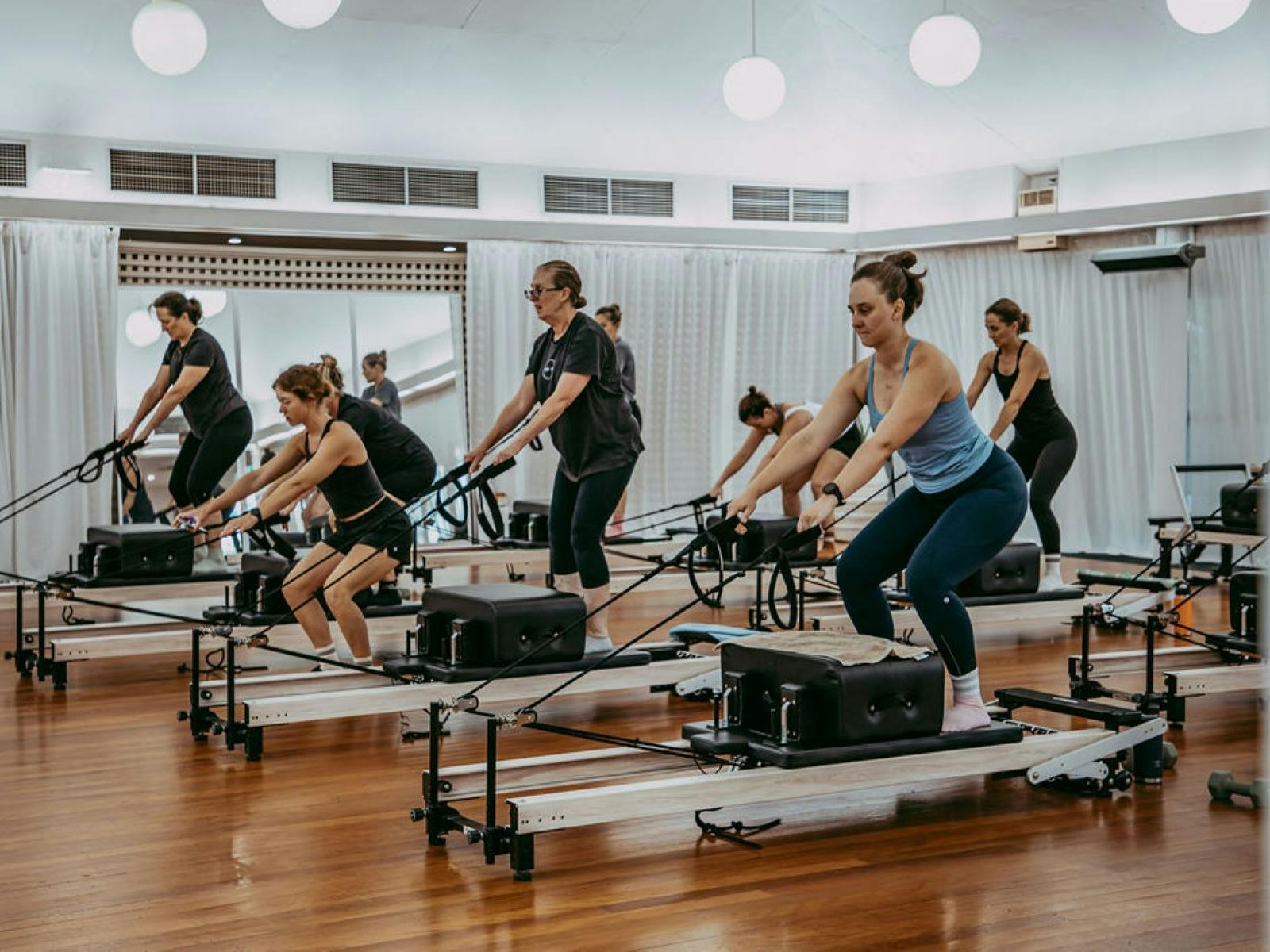 Multiple women on reformers at Sculpt Pilates Goondiwindi Multiple women on reformers at Sculpt Pilates Goondiwindi