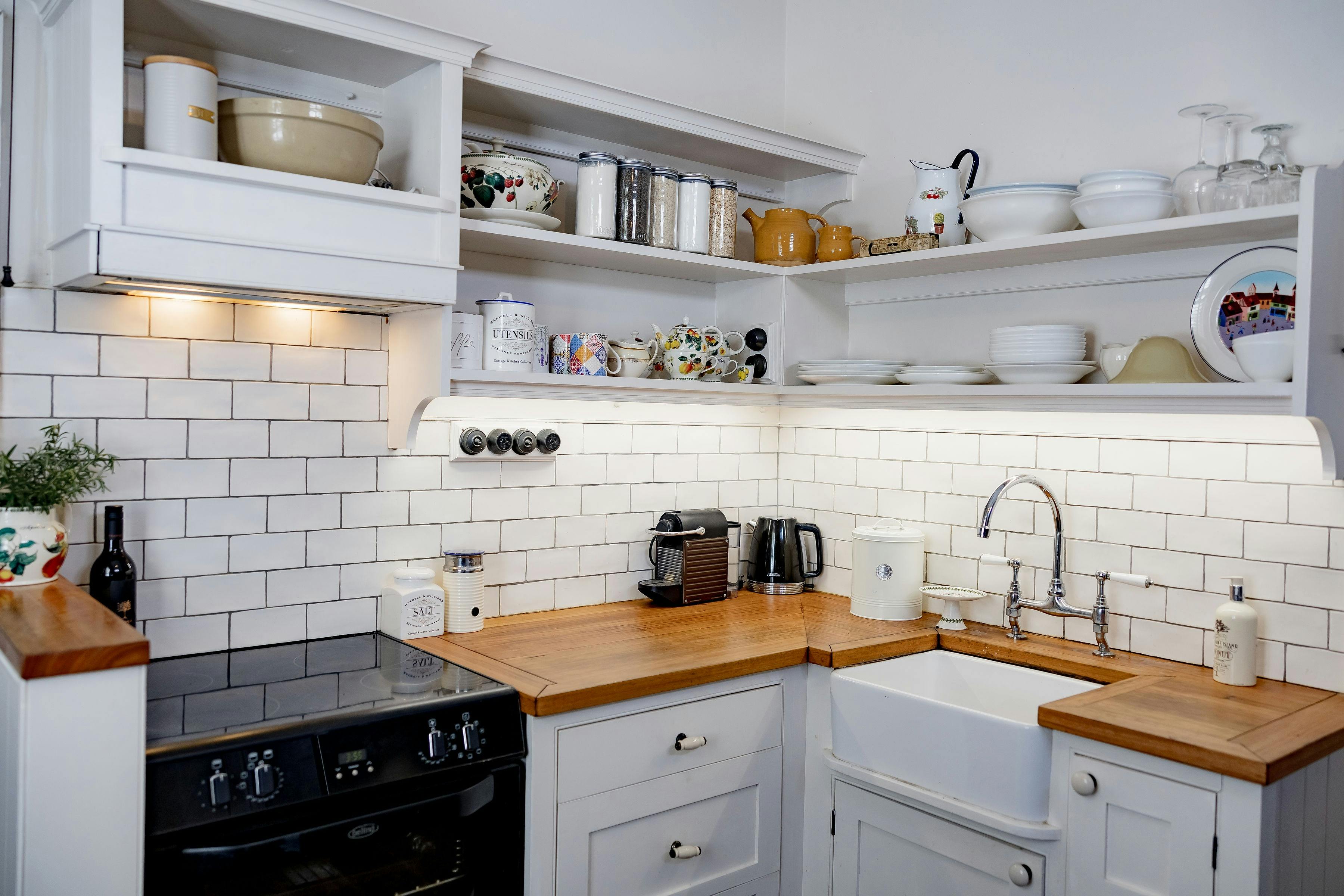 Kitchen with appliances, coffee machine and other amenities