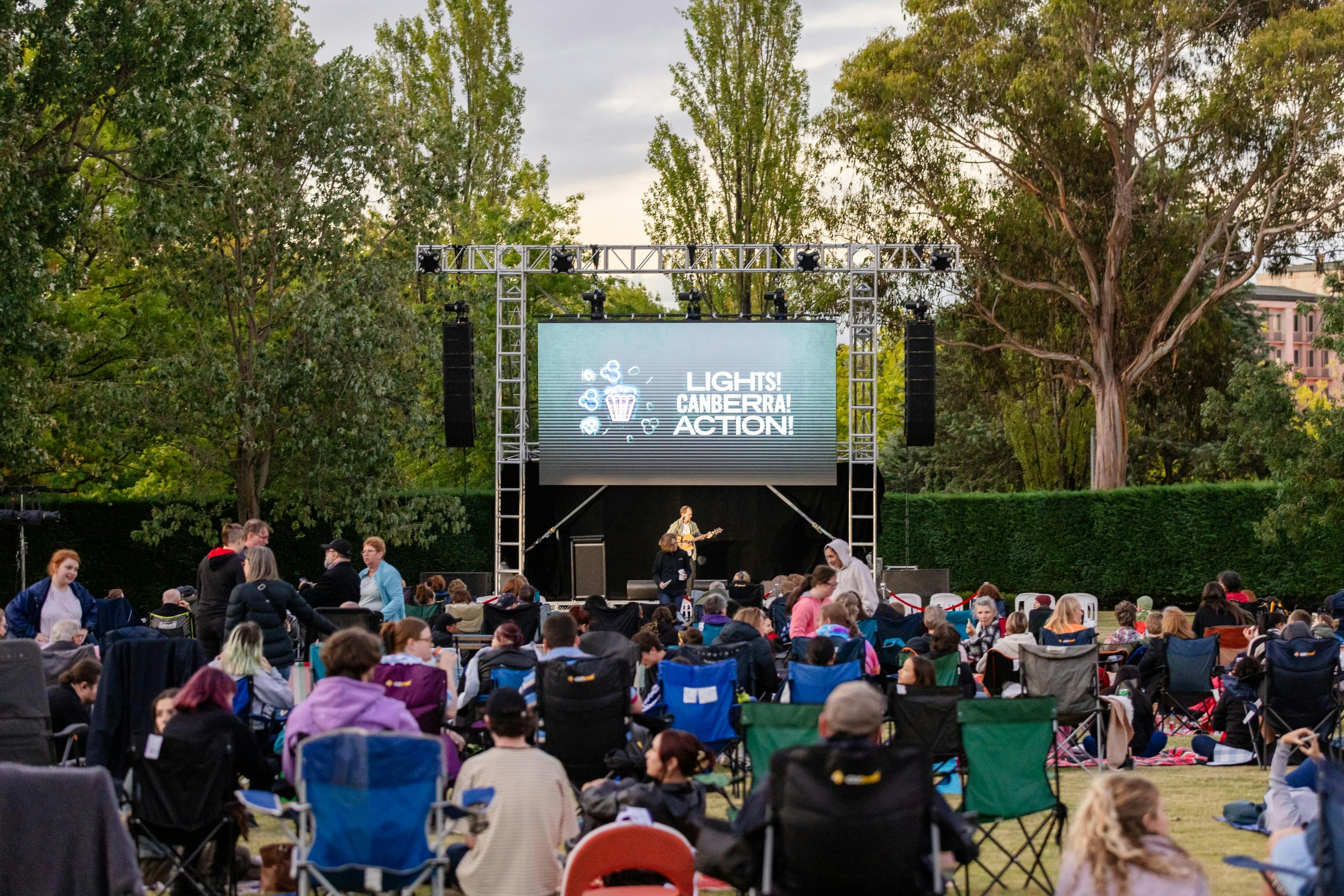Crowd sitting in front of screen for Lights! Canberra! Action!