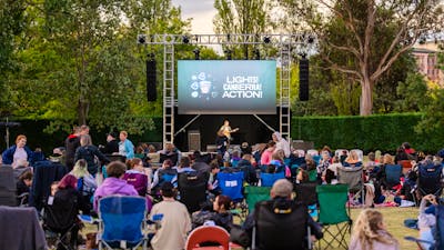 Crowd sitting in front of screen for Lights! Canberra! Action!