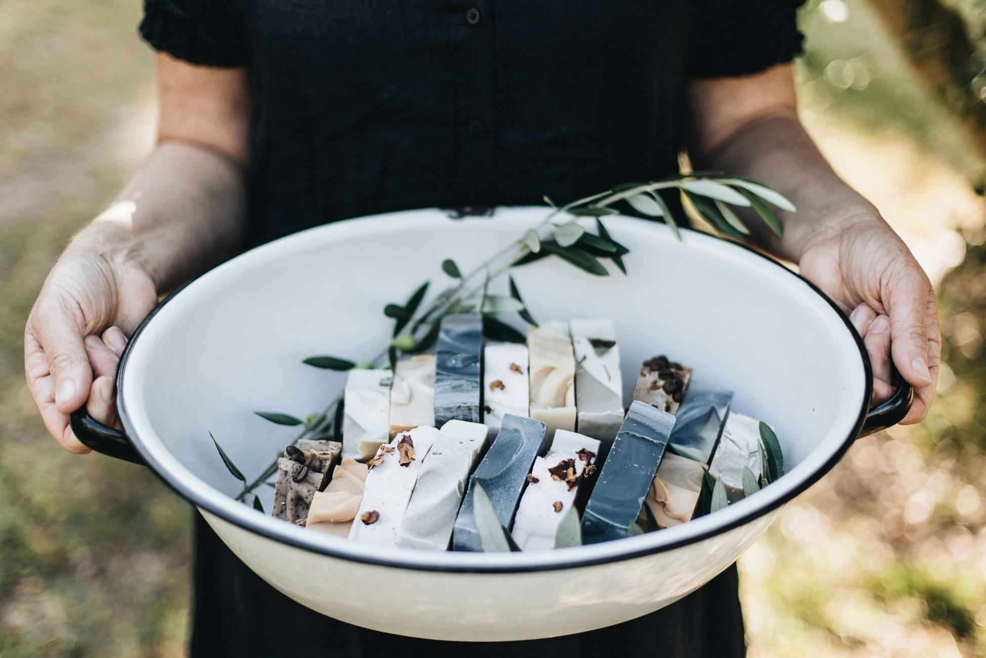 A white bowl filled with Gather & Harvest soaps