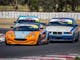 Three cars battling for position racing around Winton Motor Raceway