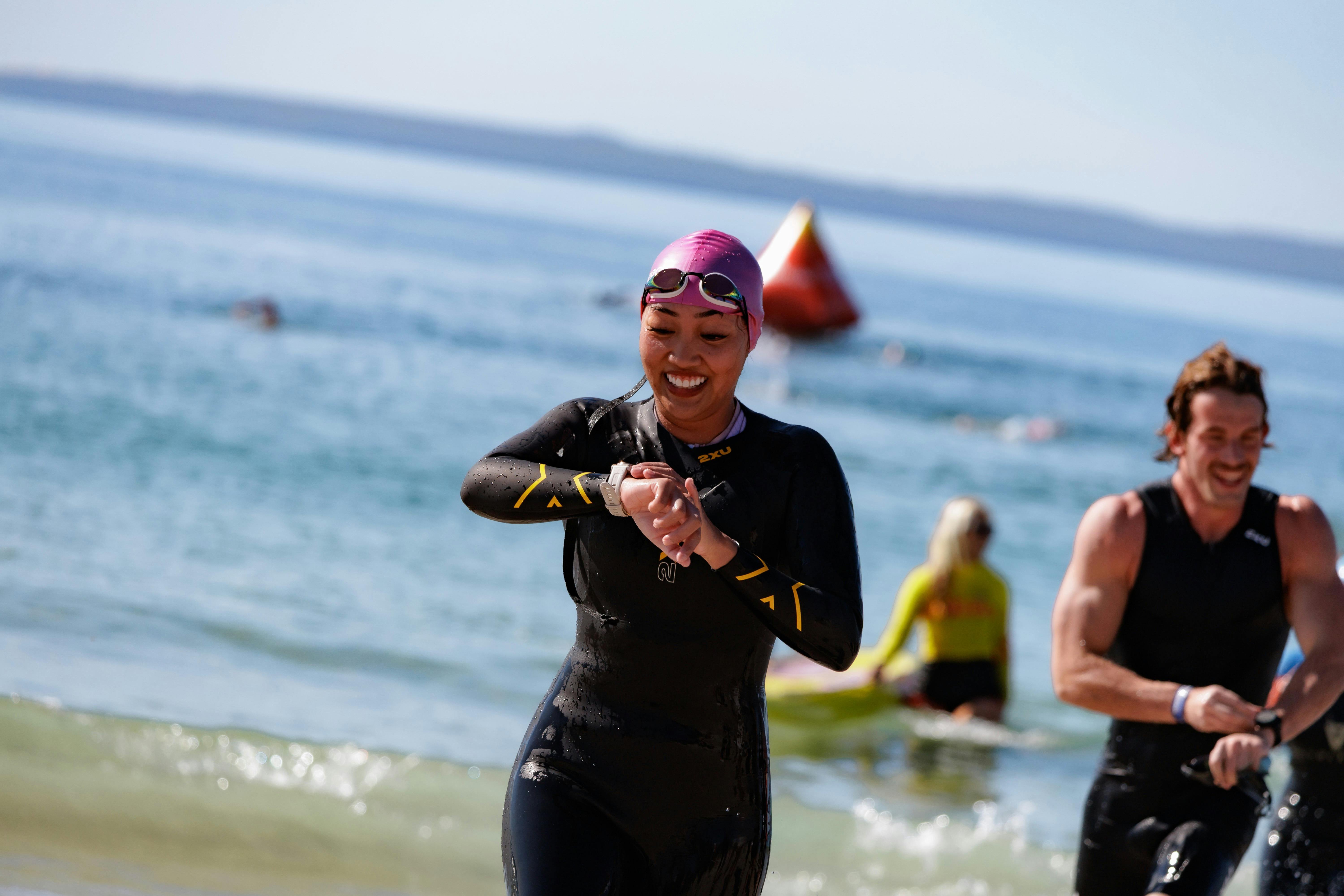 Triathlete coming out of water