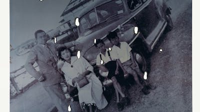 Artist Lindy Lee's black and white family photo with burnt holes on the print