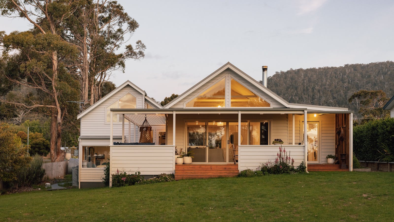 Setting sun over the water reflected on the beach facing side of The Pearl.