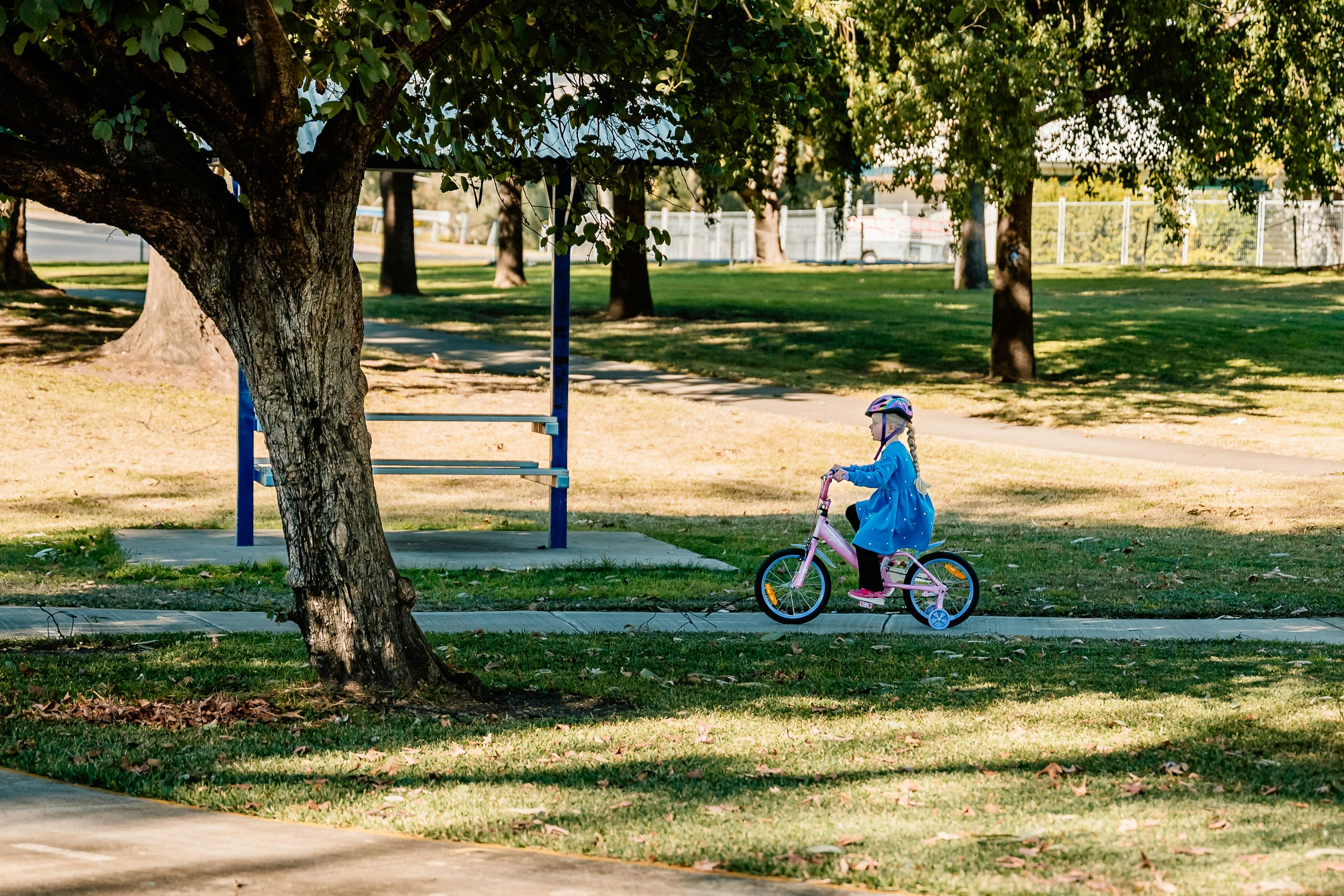 Child riding bike on path - rocket park/Kirkby Park Moree