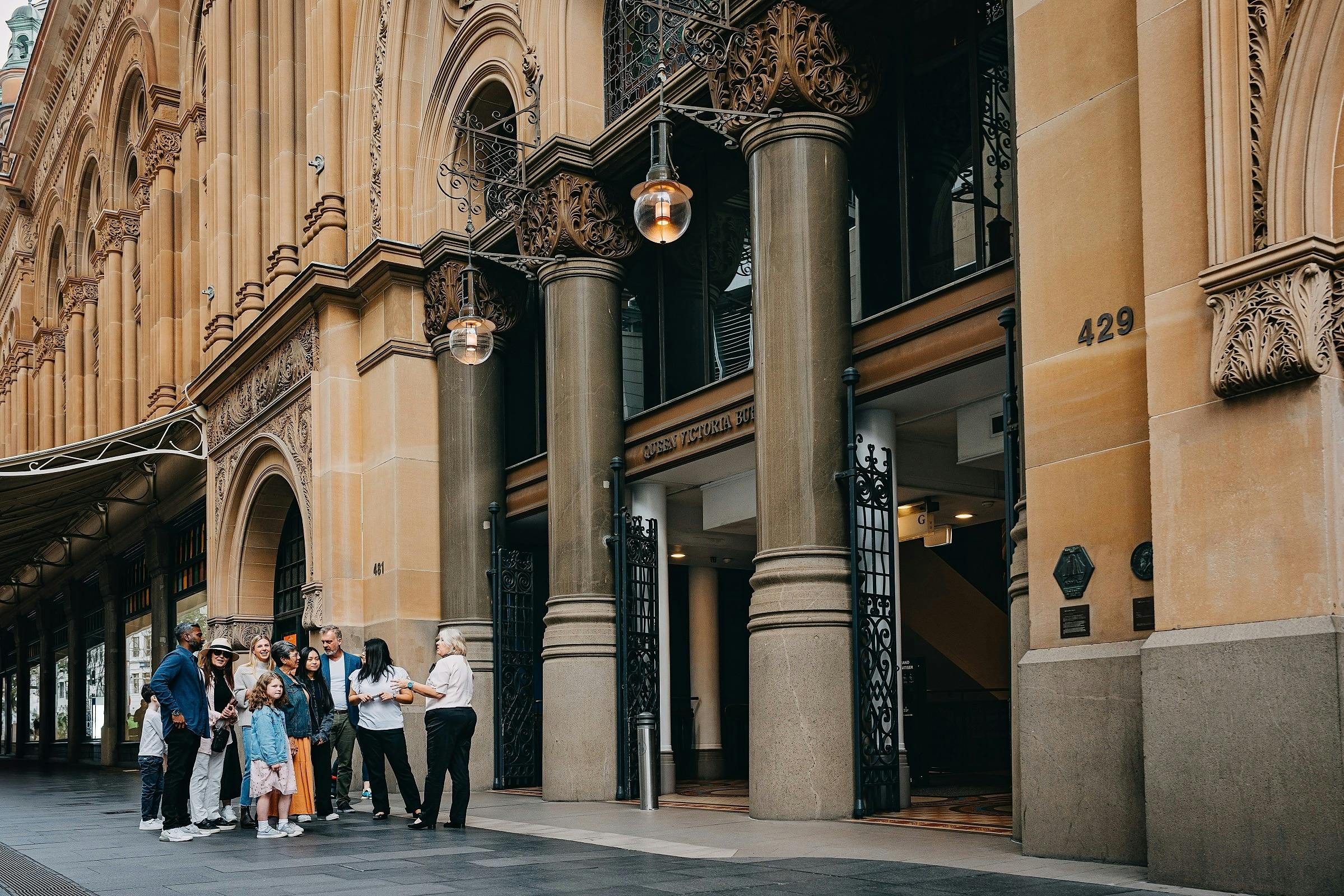 A QVB History Tour group looking at the historical facade outside the QVB on George Street