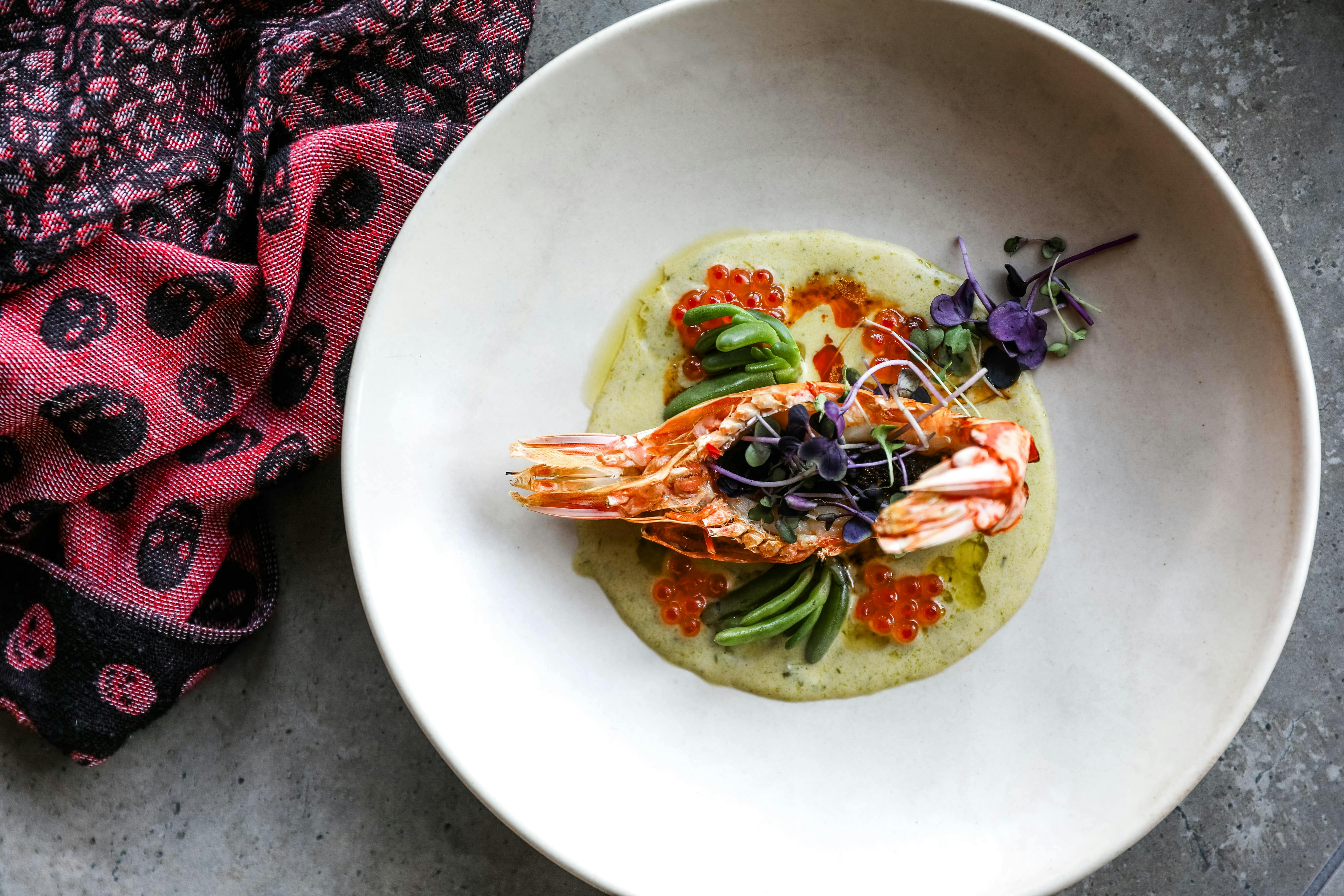 An entree dish of our Skull Island prawn, from the Spring 2024 menu