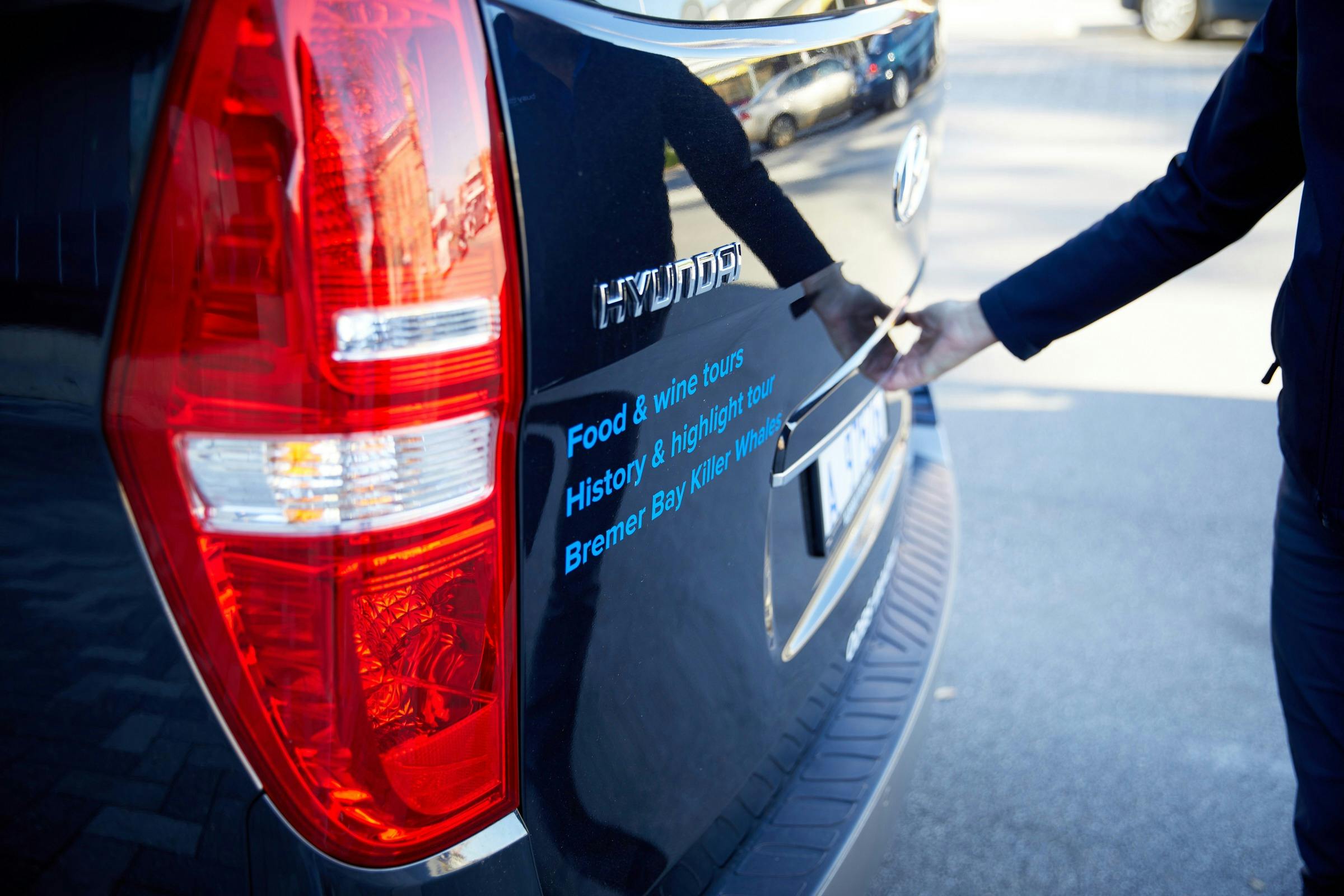 rear door of iMax Elite vehicle with person opening