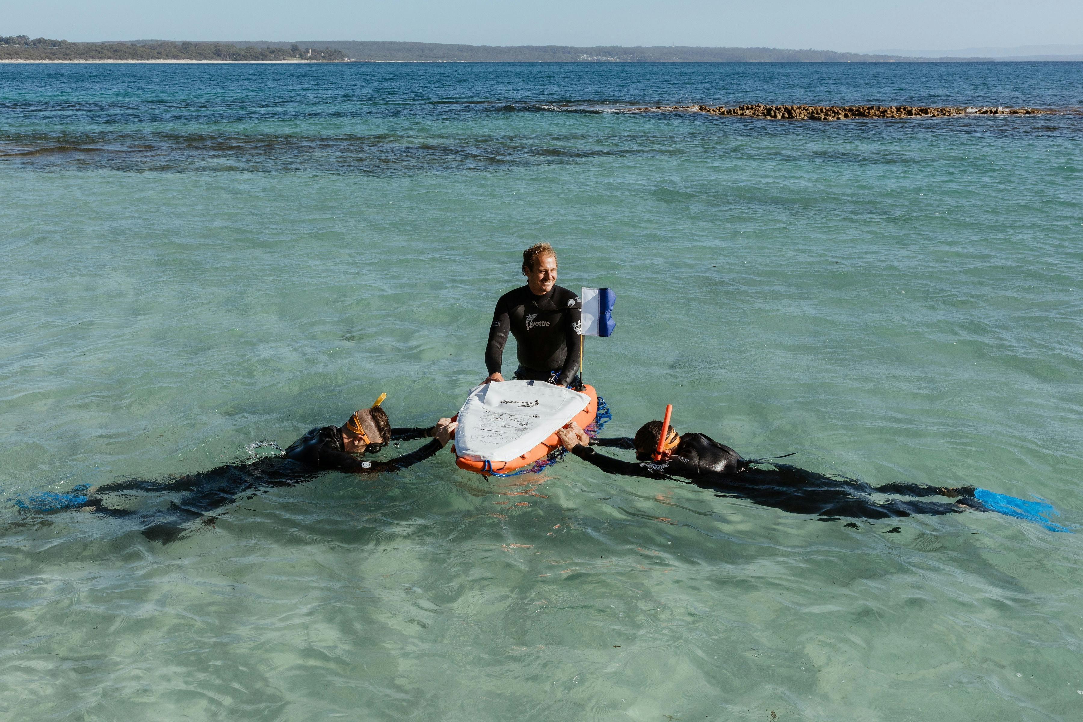 Snorkellers practising in shallow water