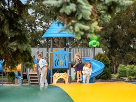 Kids jumping on an inflatable jumping pillow