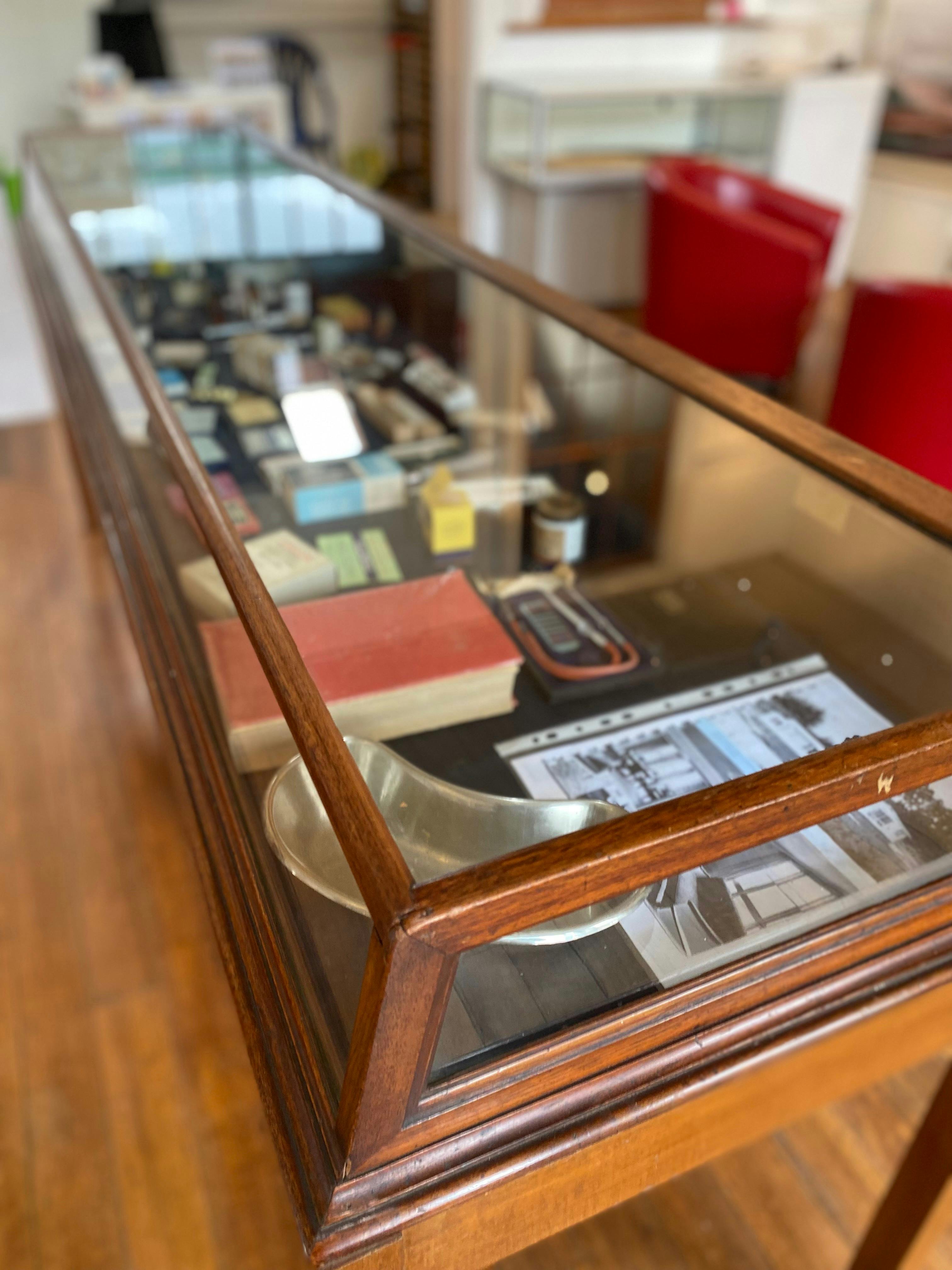 Glass display cabinet with old medical equipment