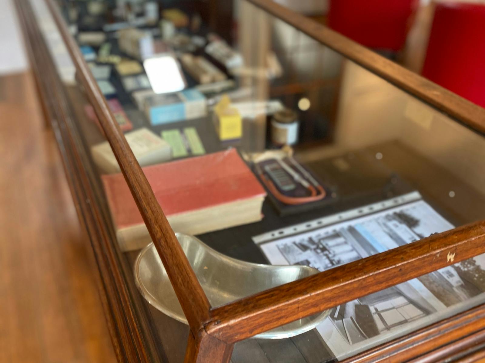 Glass display cabinet with old medical equipment