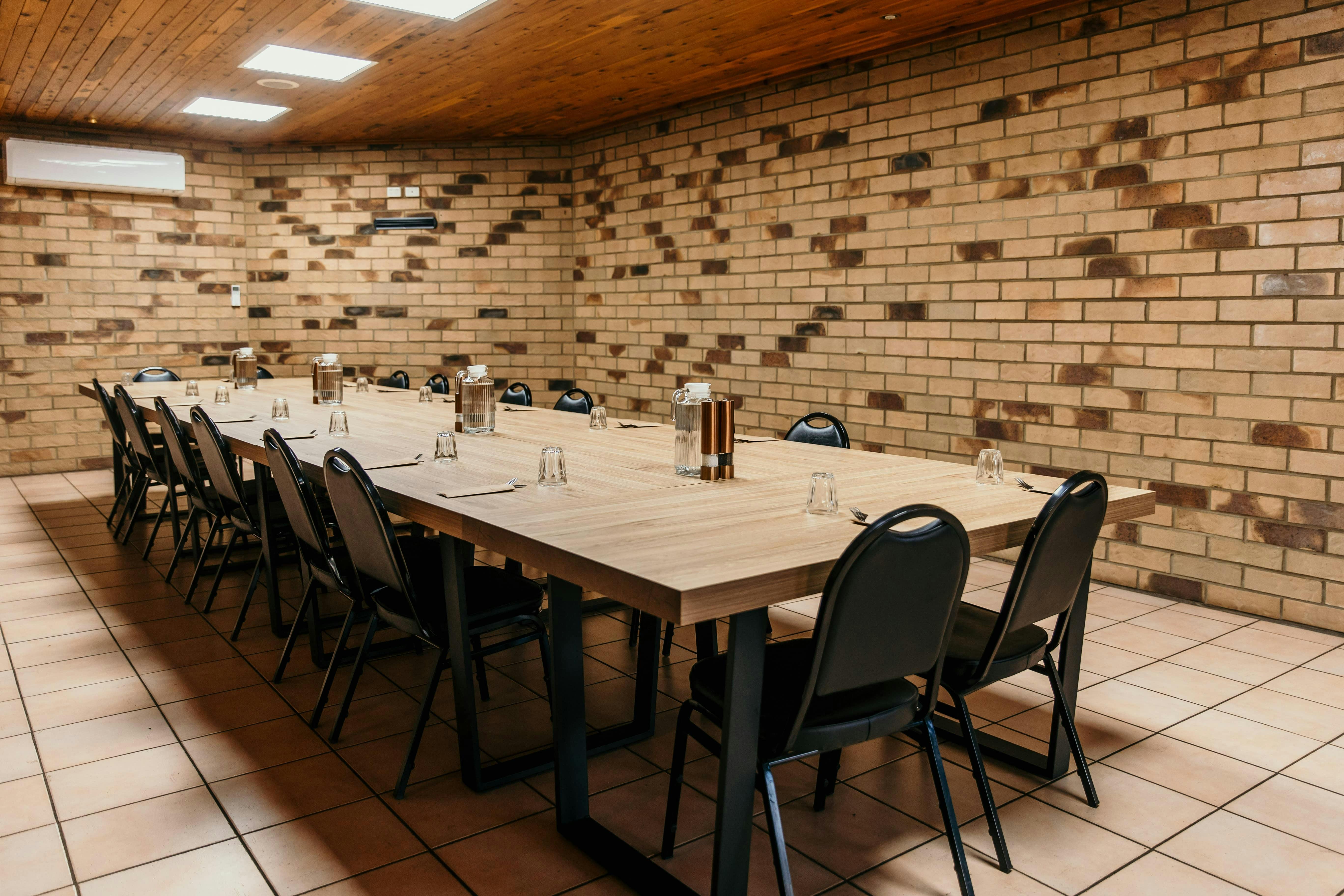 A conference room with a meeting table set up.