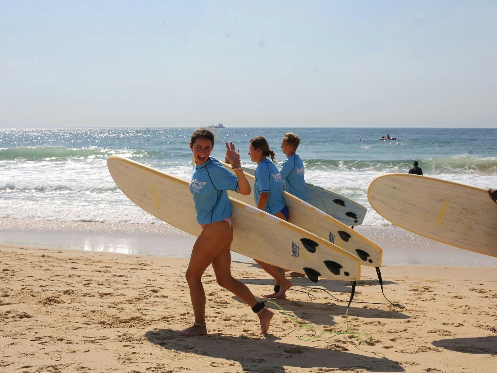 Surfers running to the water Surfers running to the water