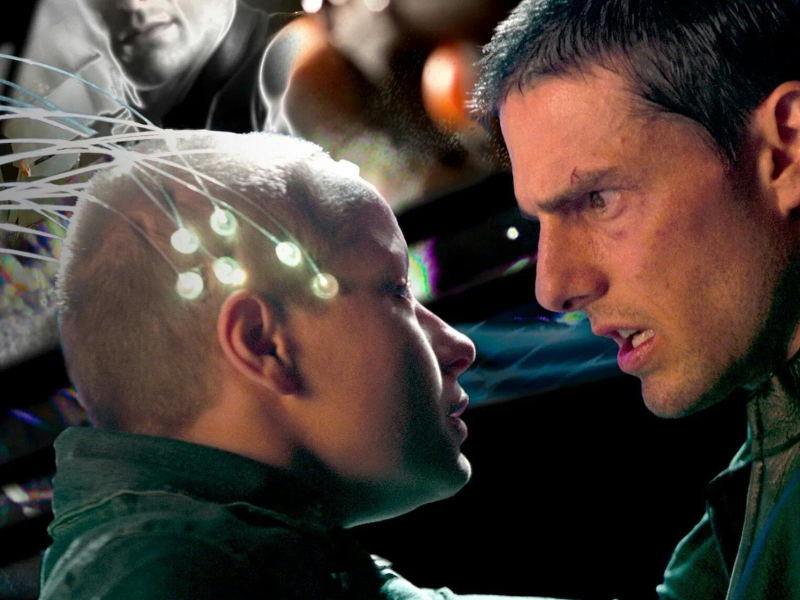 Man looks sternly at young child with nodes attached to the head