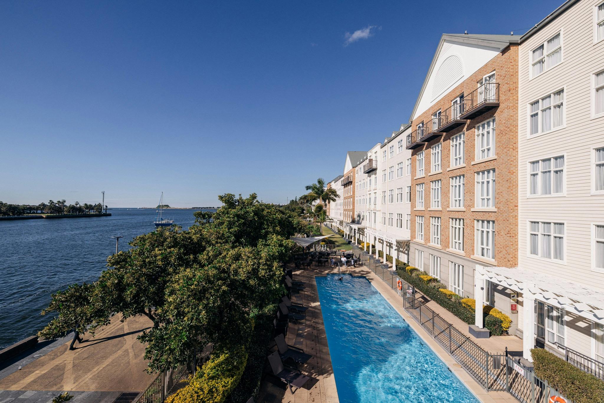 Hotel Exterior showing outdoor pool and harbour views