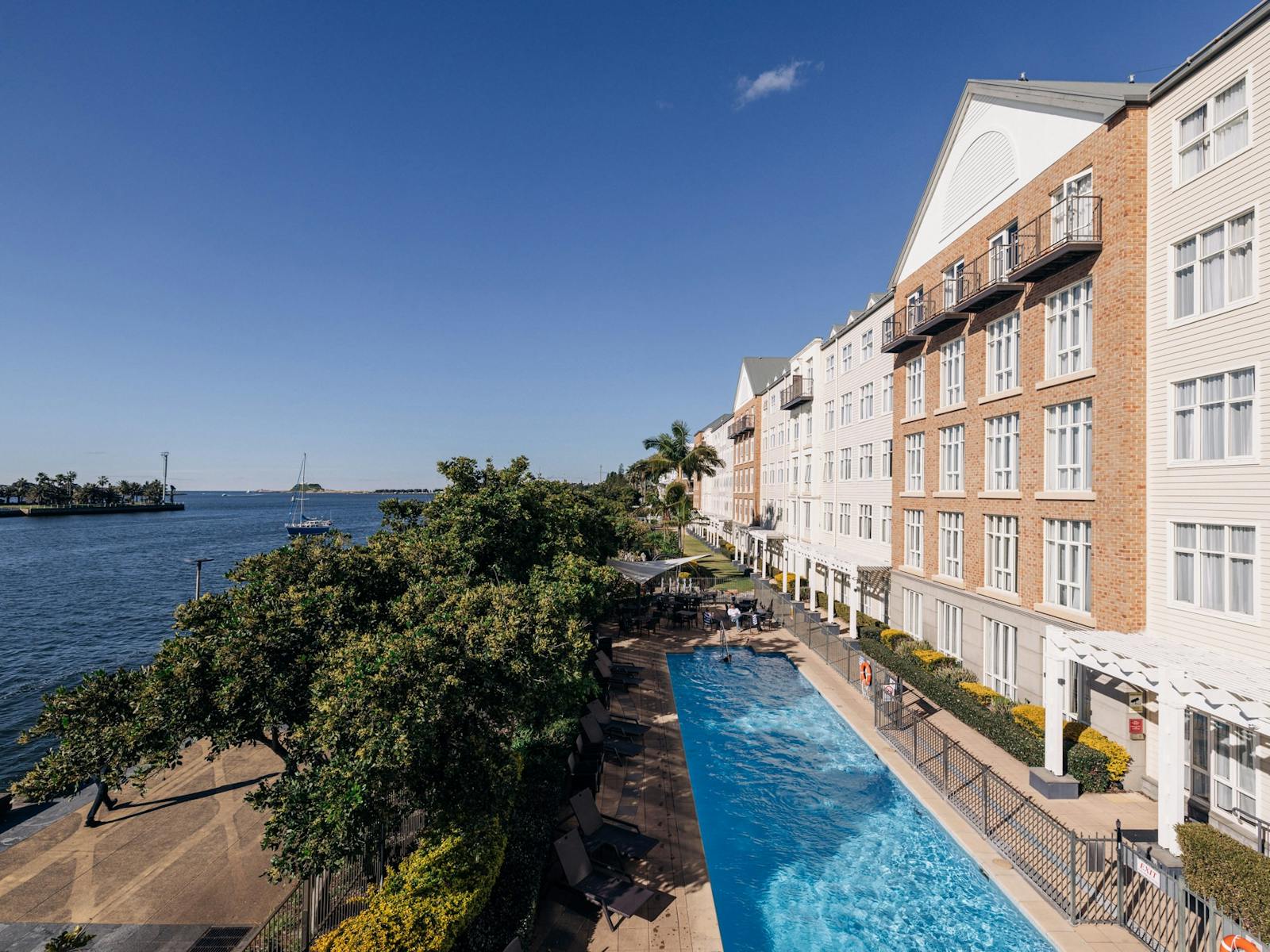 Hotel Exterior showing outdoor pool and harbour views