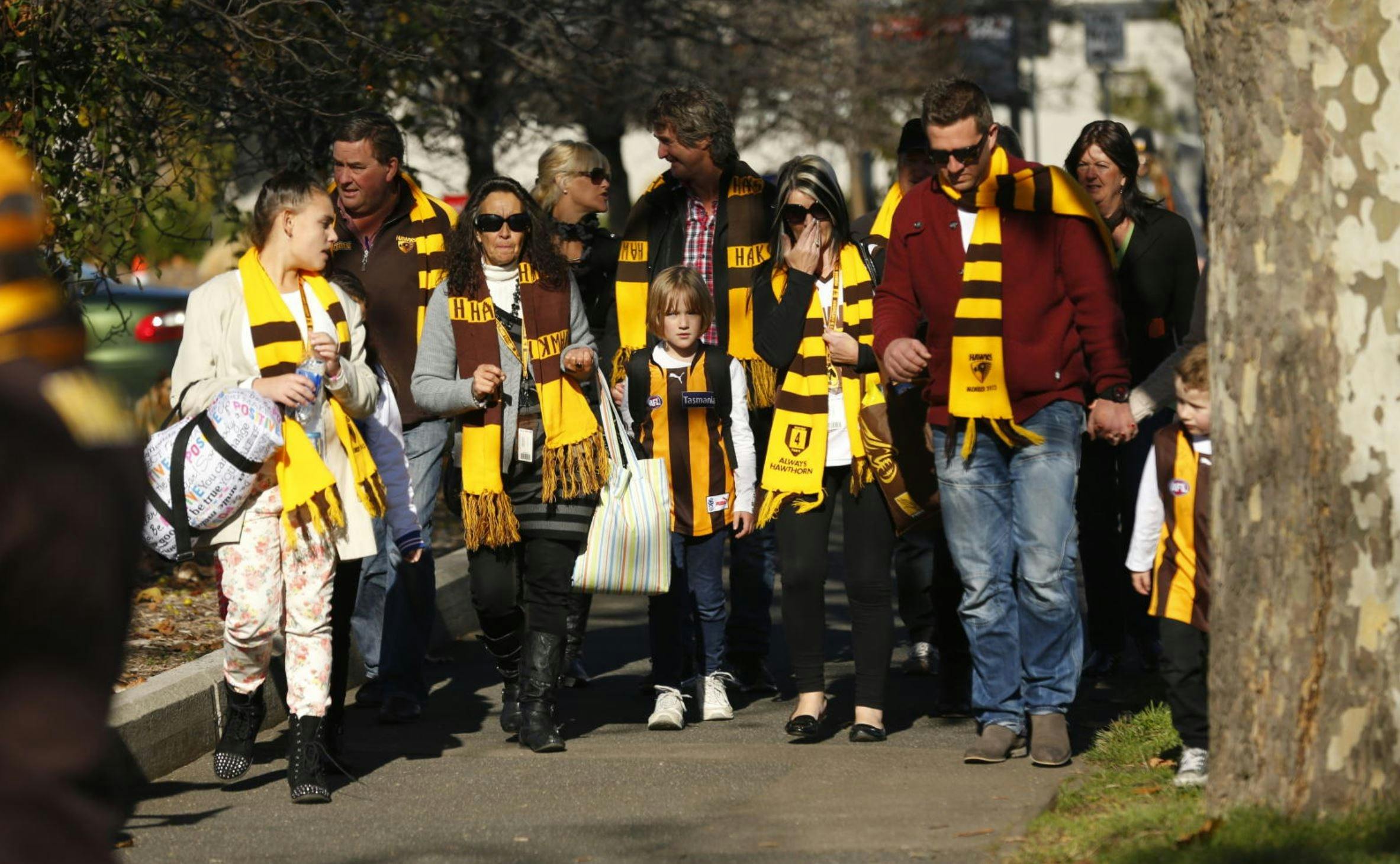 Hawthorn fans walk to the game in Launceston