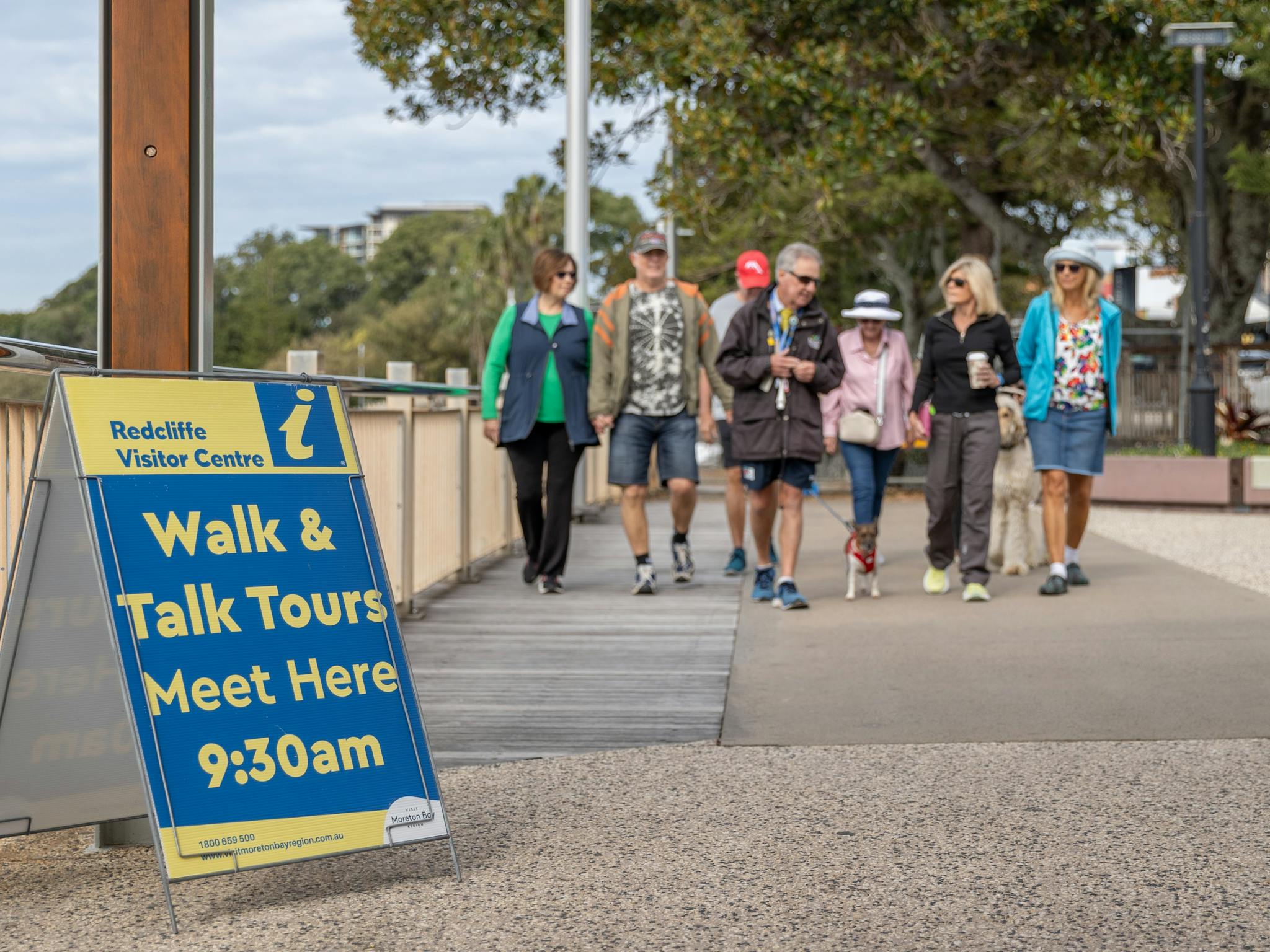 A guide talking while visitors are walking alongside him, near the Redcliffe Jetty. A guide talking while visitors are walking alongside him, near the Redcliffe Jetty.