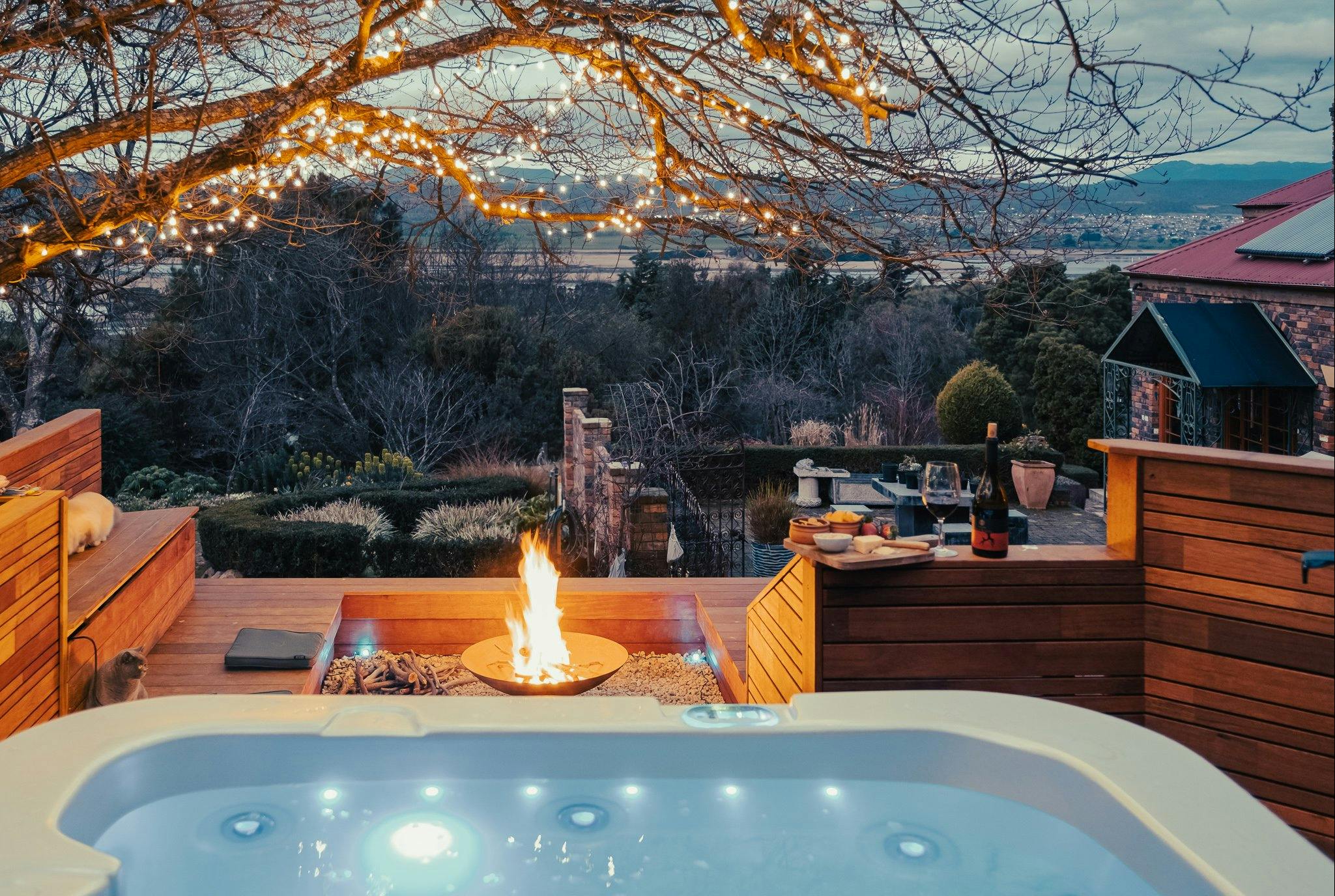 Outdoor Spa in rock garden with fire pit, views of Tamar Valley and River with moutain s &amp; garden