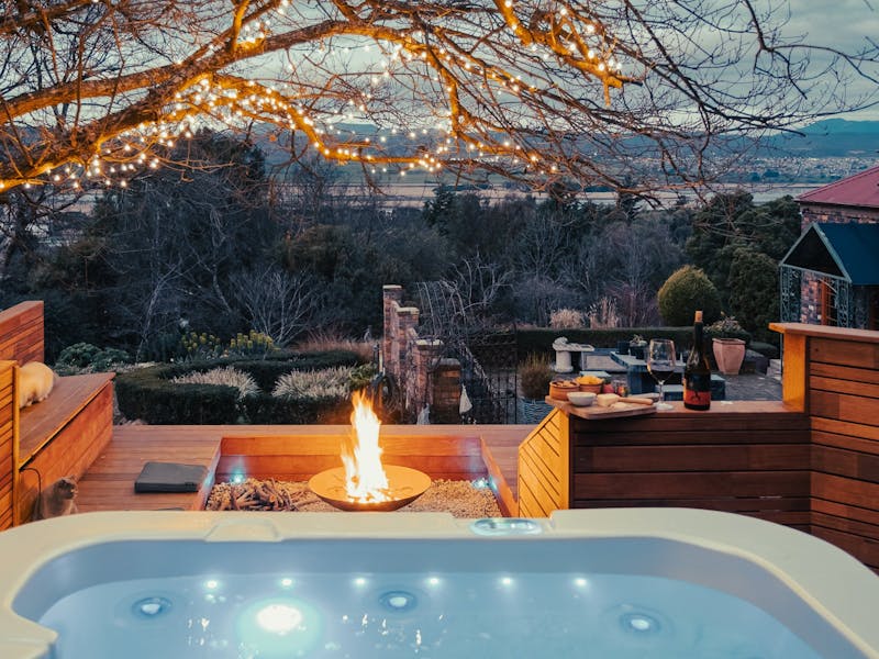 Outdoor Spa in rock garden with fire pit, views of Tamar Valley and River with moutain s & garden