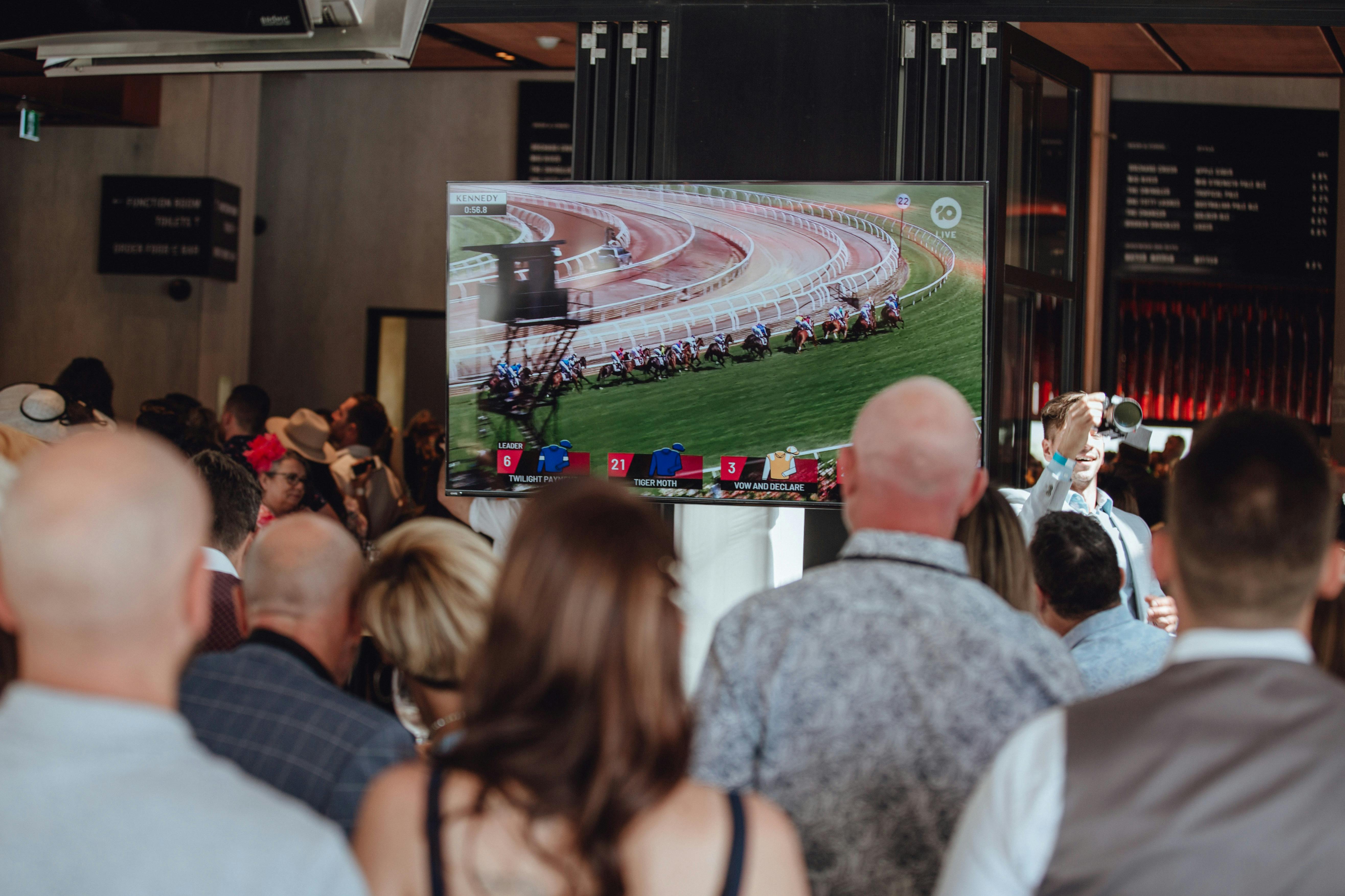People watching Melbourne Cup on TV