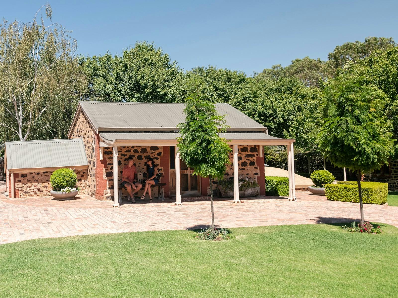 "Sitting outside the restored historic buildings at Langmeil Winery, enjoying the beautiful surround