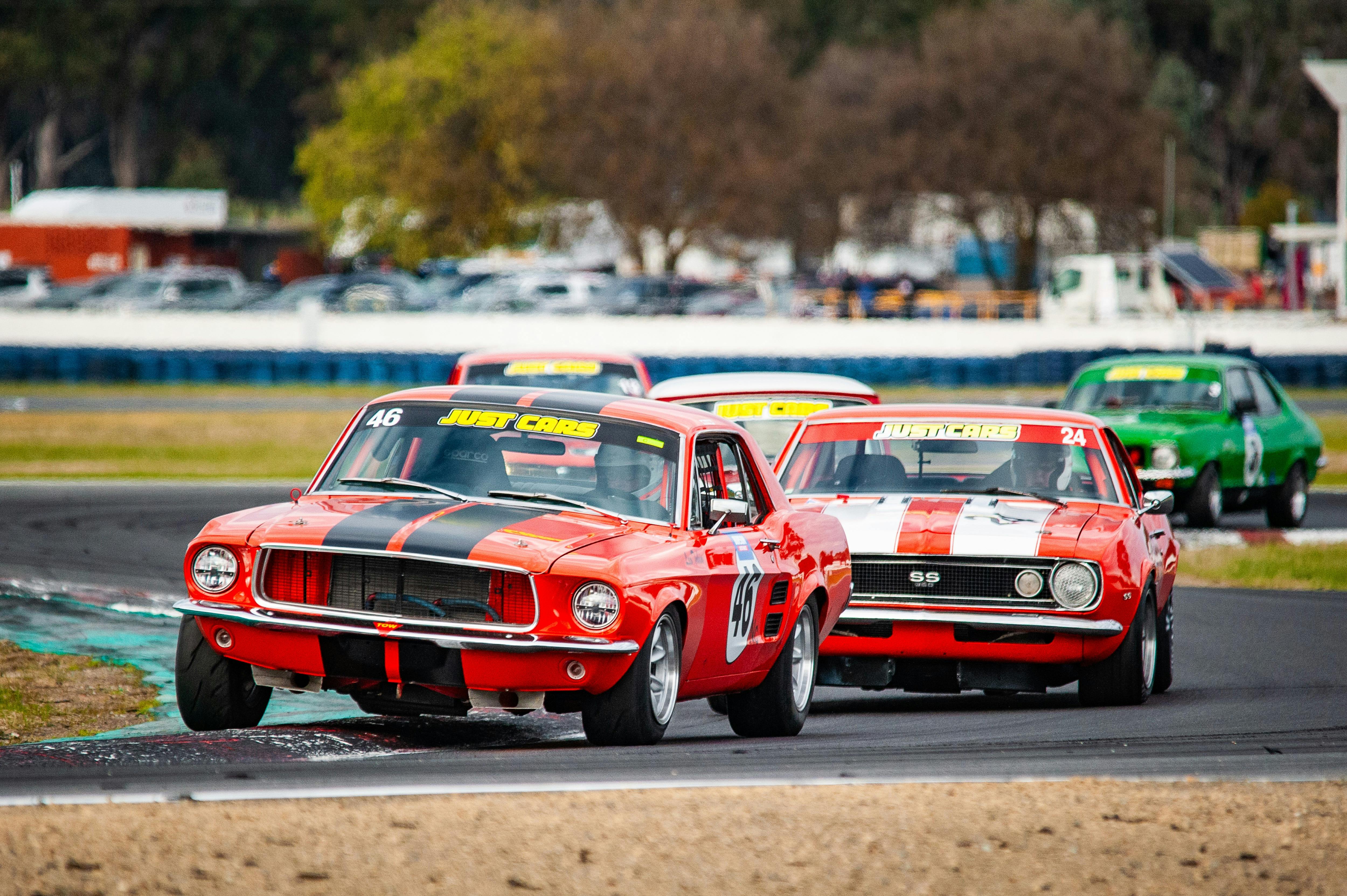 red sports cars on track racing