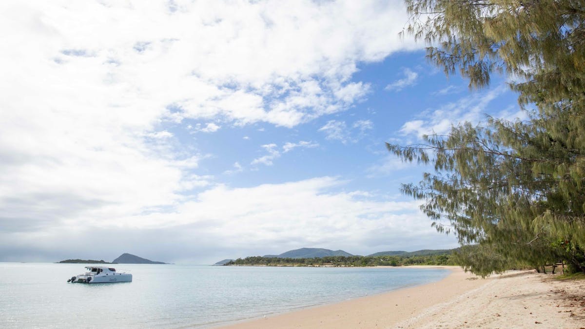 Image of Dingo Beach with boat in the water